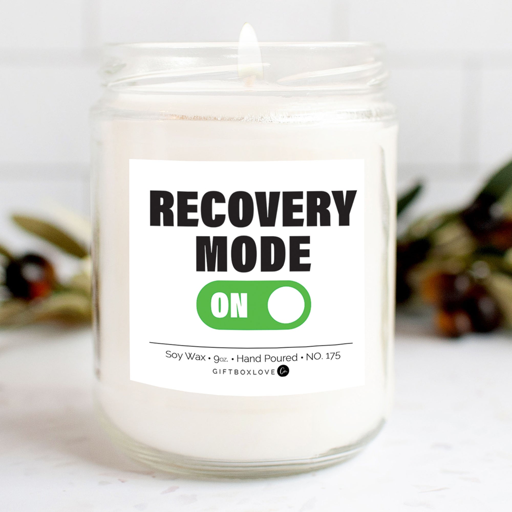 vanilla scent soy wax candle.  Candle label reads Recovery Mode