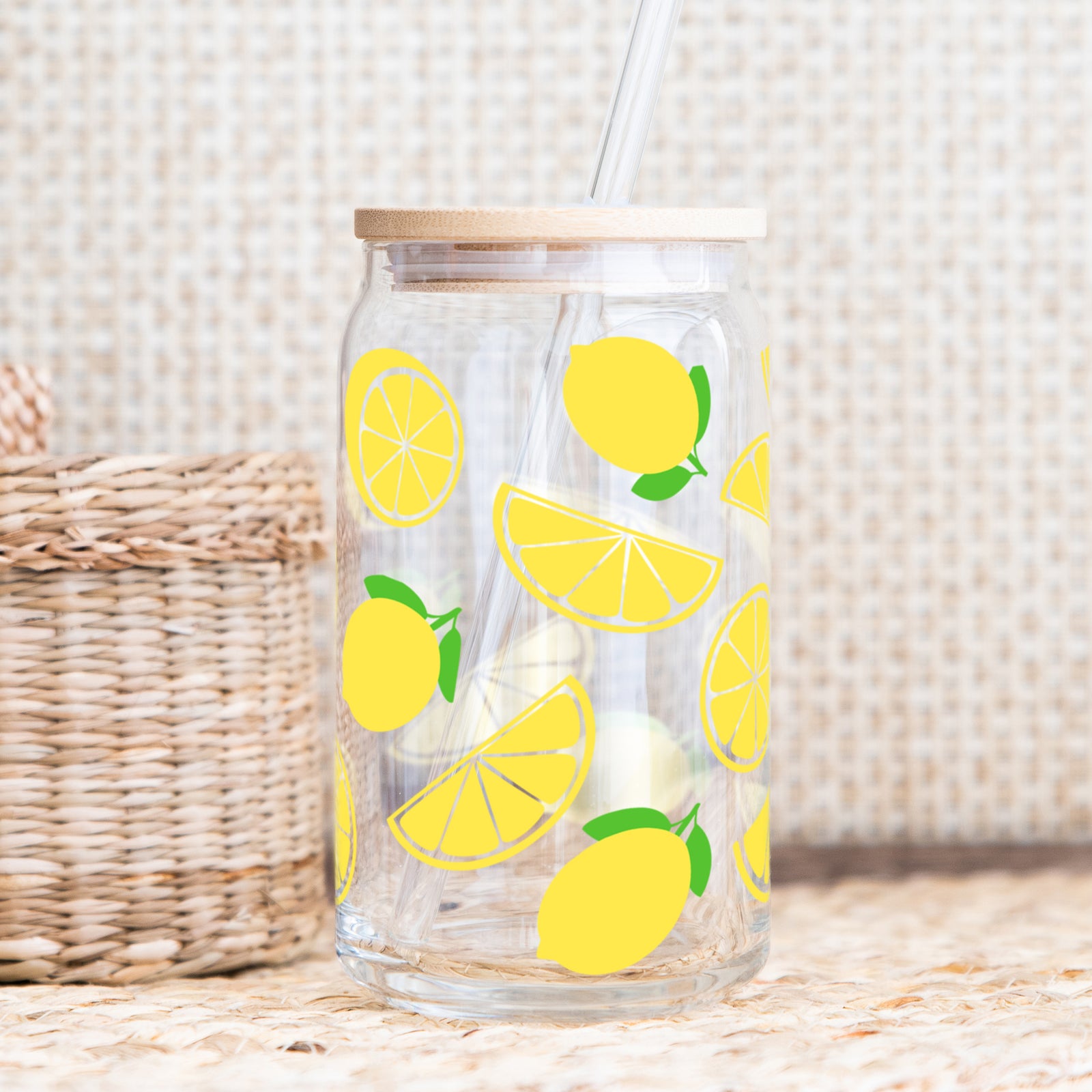 Lemon themed glass cup with bamboo lid and straw, perfect for summer drinks