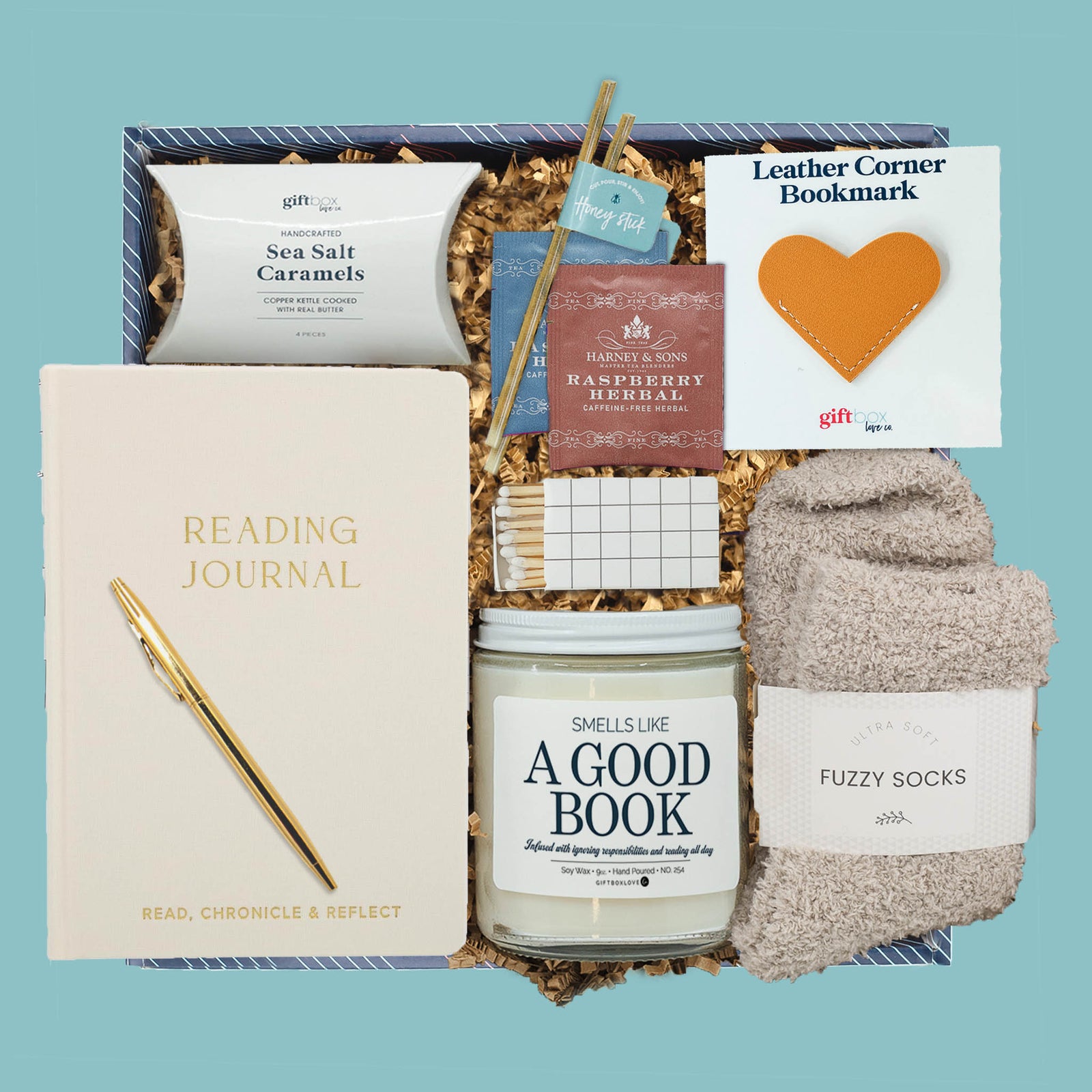Bookish Bliss Gift Box with candle, journal, tea, socks, and caramels