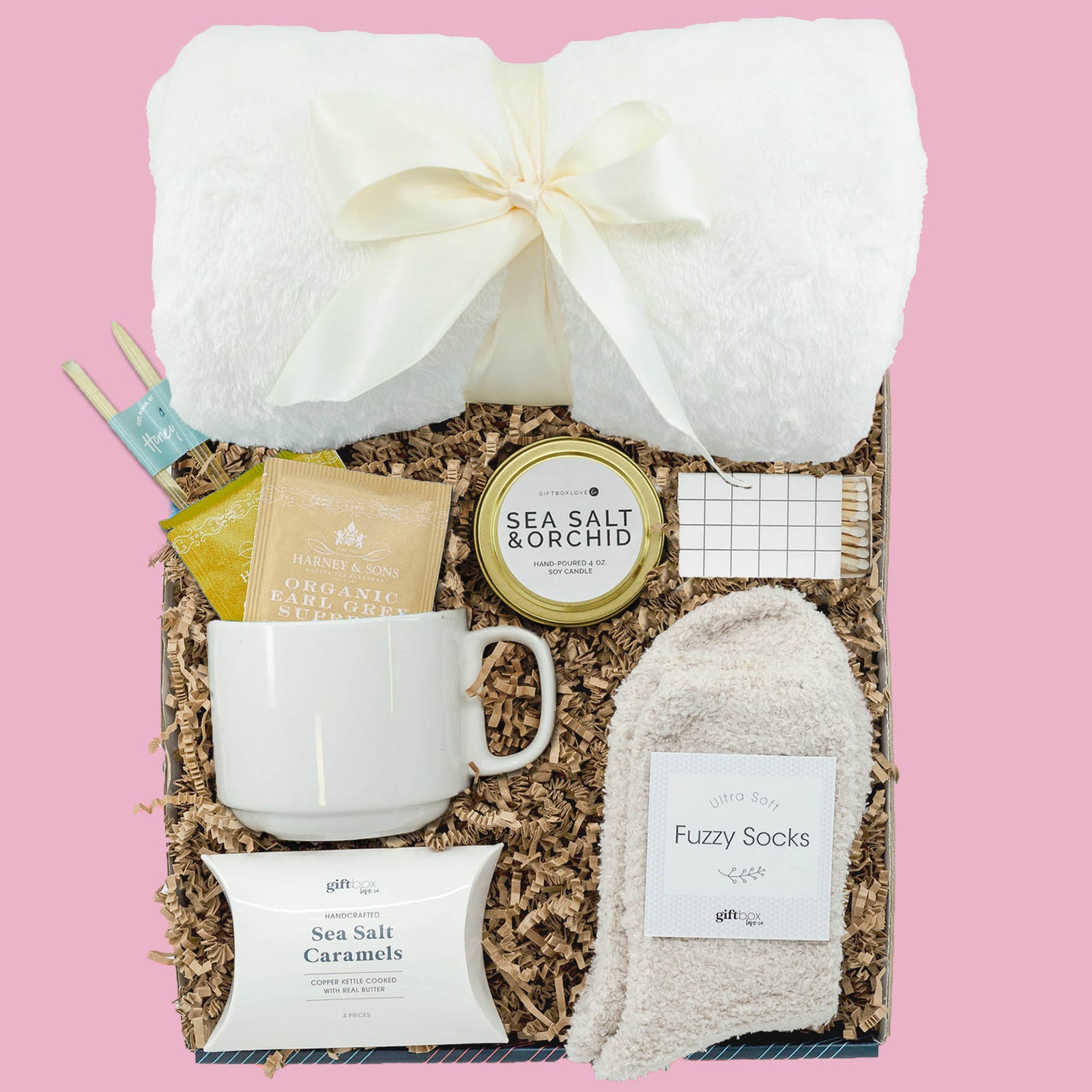Easter comfort gift box with tea, mug, blanket, fuzzy socks, candle and caramels
