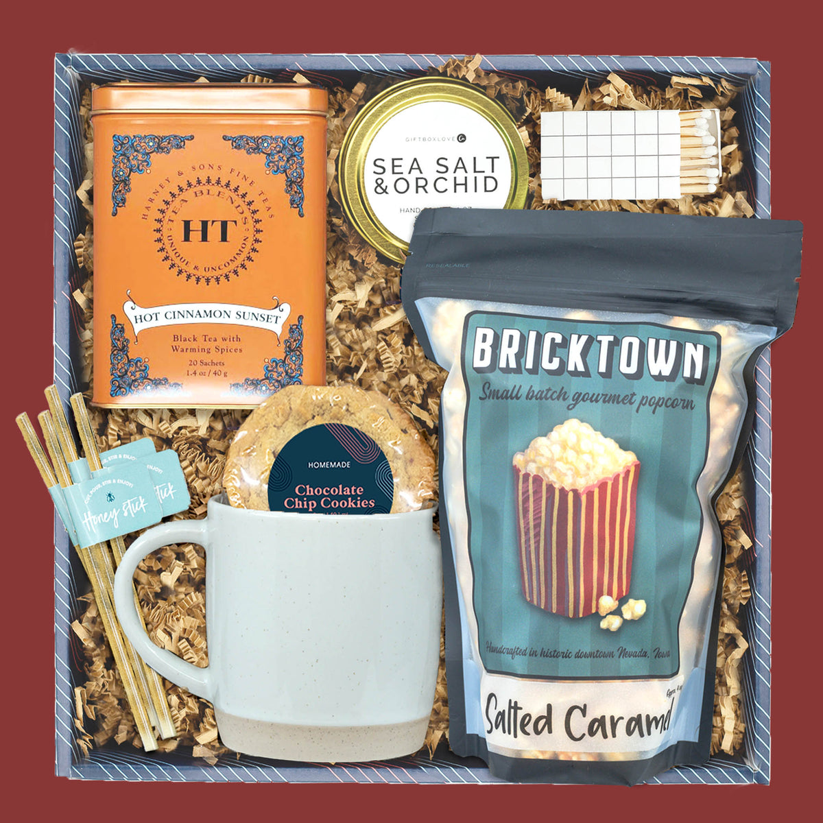 Cinnamon and Cheer holiday gift box with tea, candle, popcorn, and mug