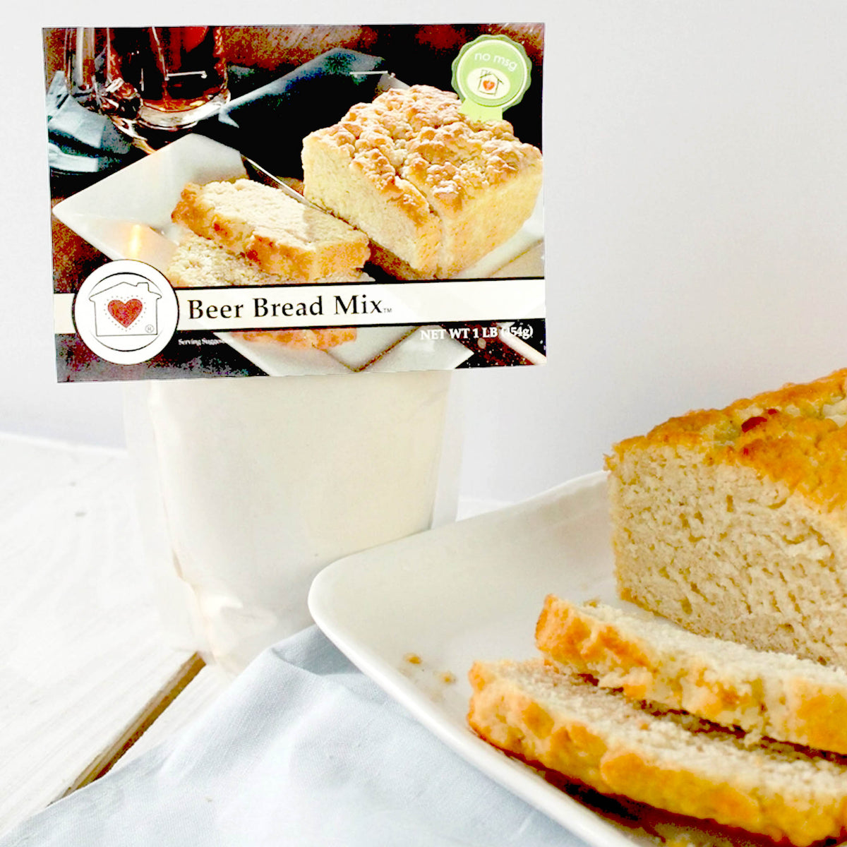 beer bread mix with baked loaf and butter knife