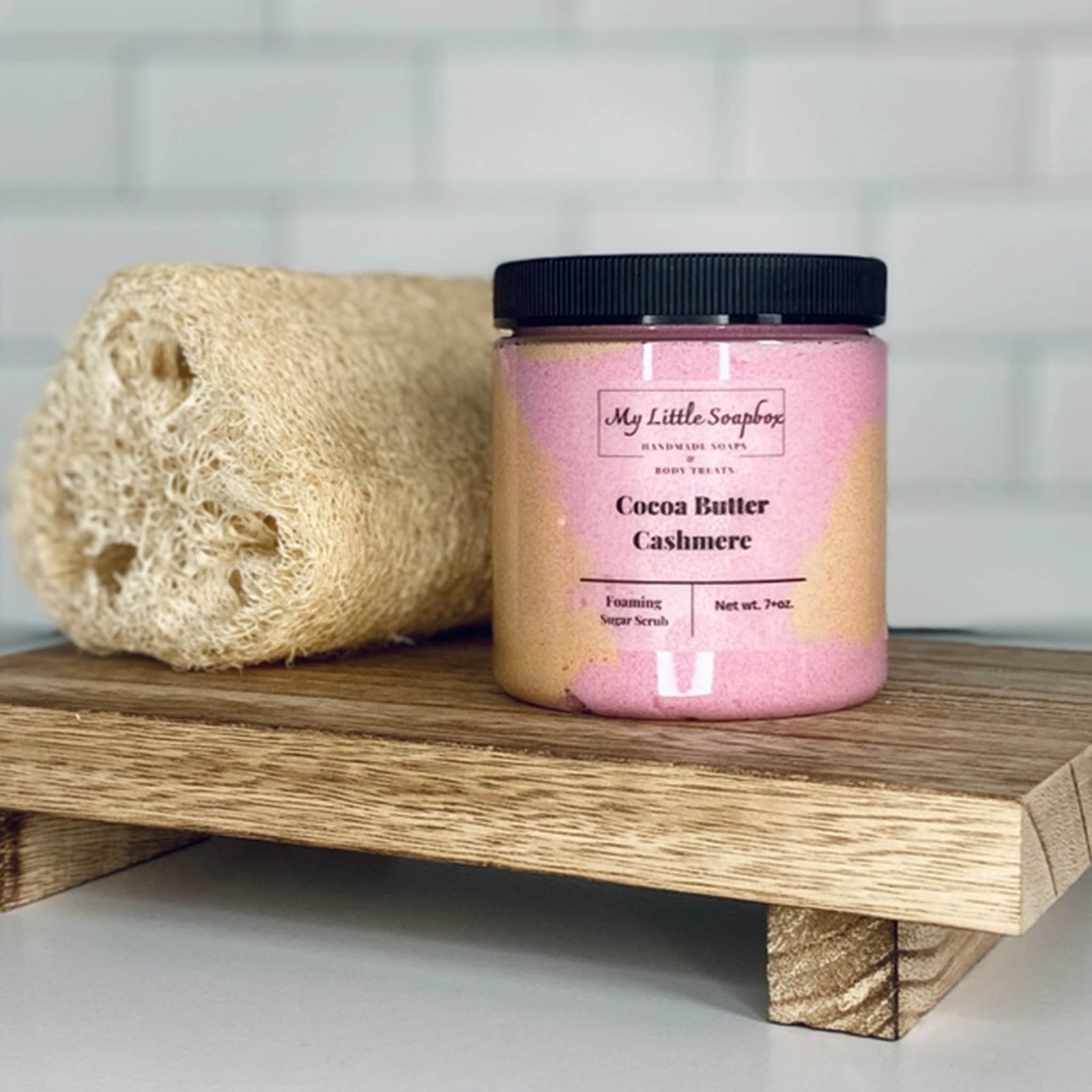 Cocoa butter cashmere foaming sugar scrub in jar with exfoliating body polish texture