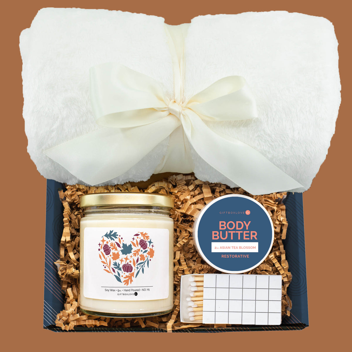 Comfort & Calm Gift Box with plush blanket, autumn heart candle, body butter, and matches.