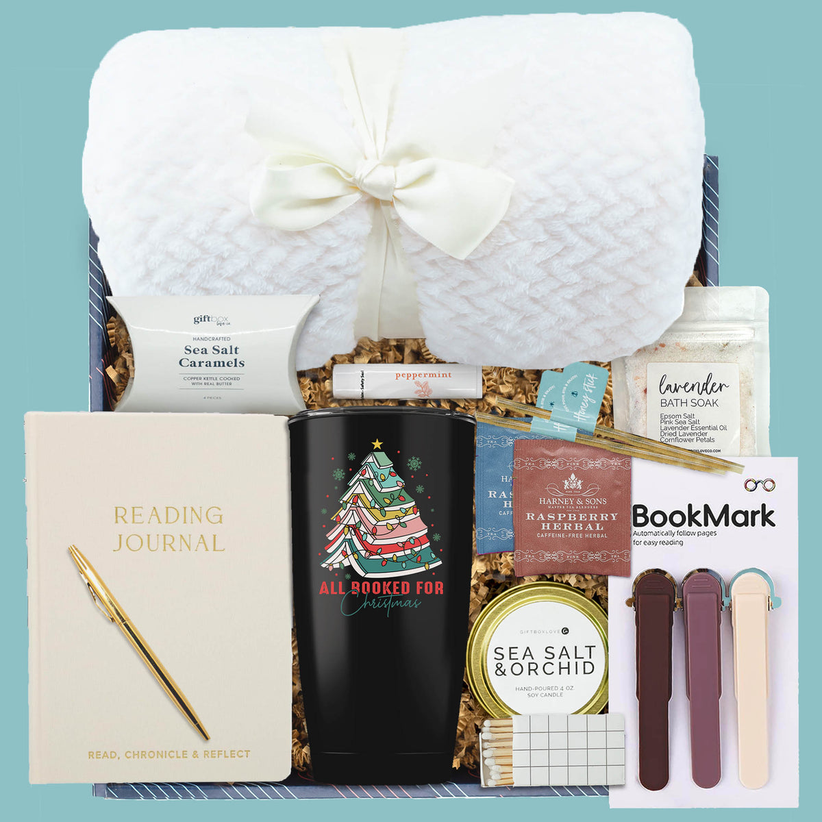 Cozy Christmas Book Lover Gift Box with blanket, tumbler, journal, tea, candle, and treats