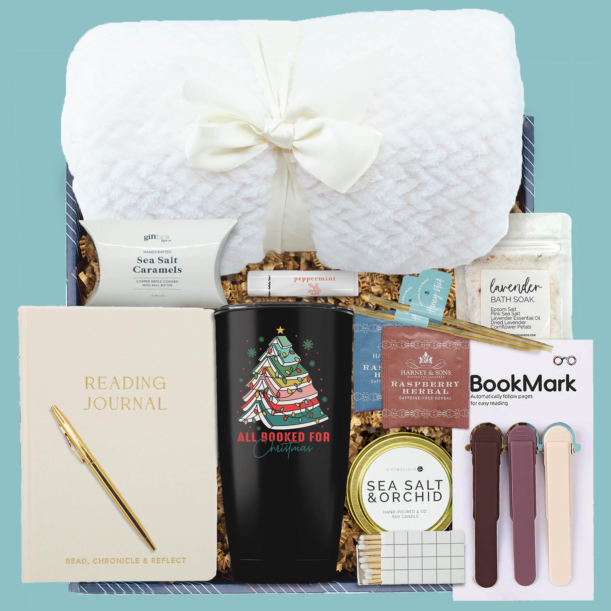 Cozy Christmas Book Lover Gift Box with blanket, tumbler, journal, tea, candle, and treats