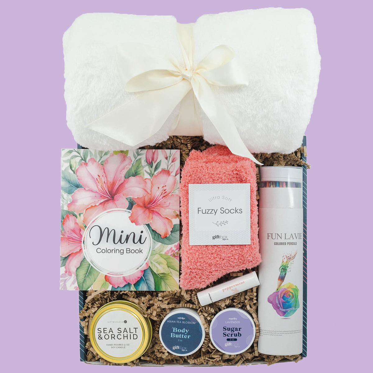 Creative Easter gift box with coloring book, blanket, fuzzy socks, candle and spa items