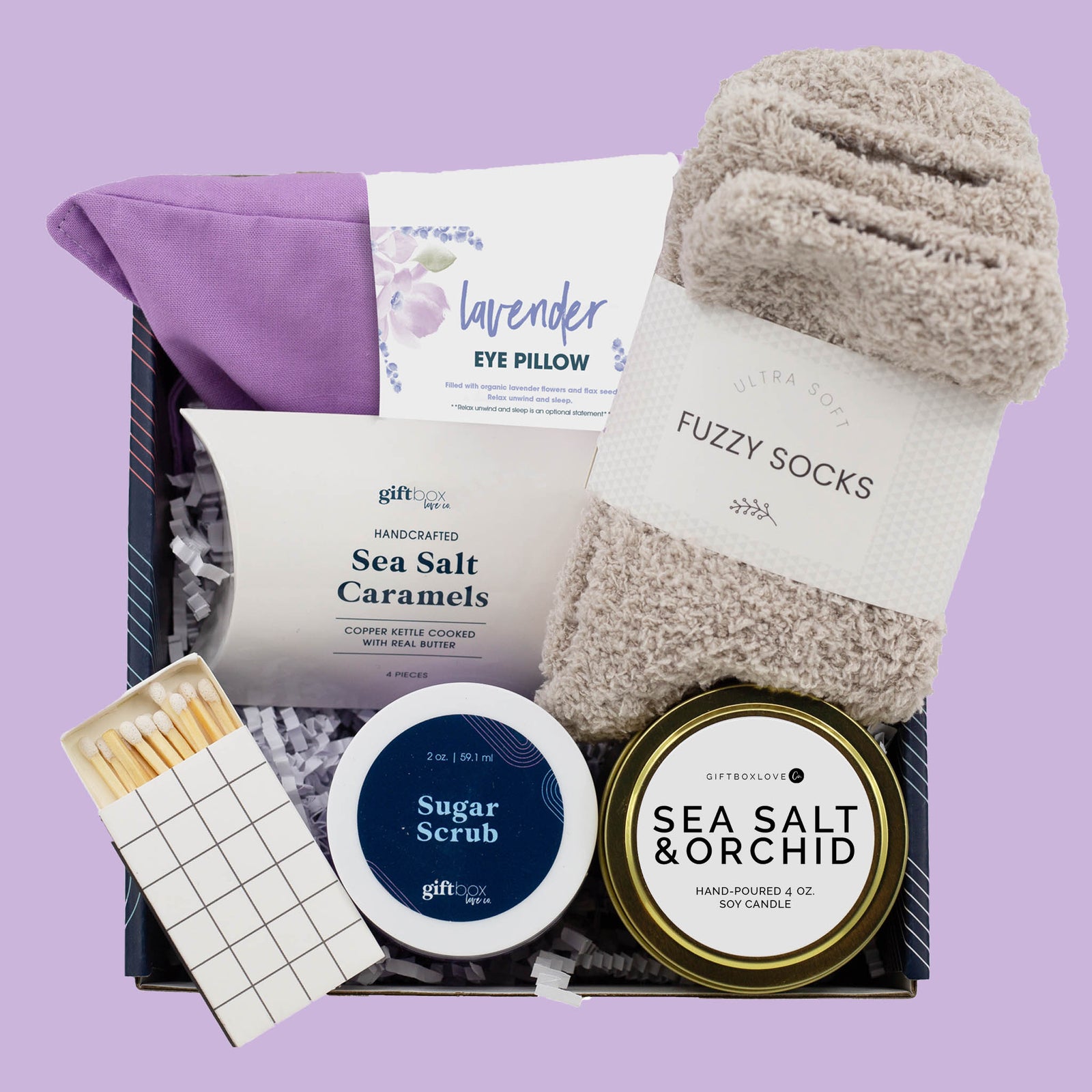 Easter serenity gift box with lavender eye pillow, candle, fuzzy socks, sugar scrub and caramels