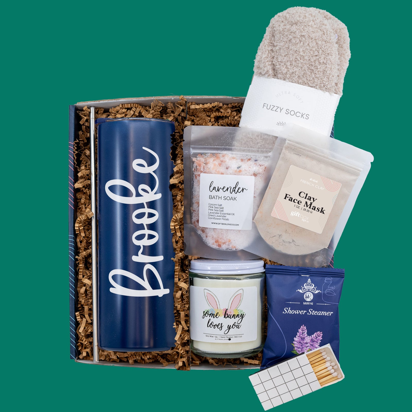 Easter Tumbler and Candle Spa Gift Box with personalized tumbler, 9 oz soy candle, bath soak, shower steamer, fuzzy socks, clay mask, and handwritten card.