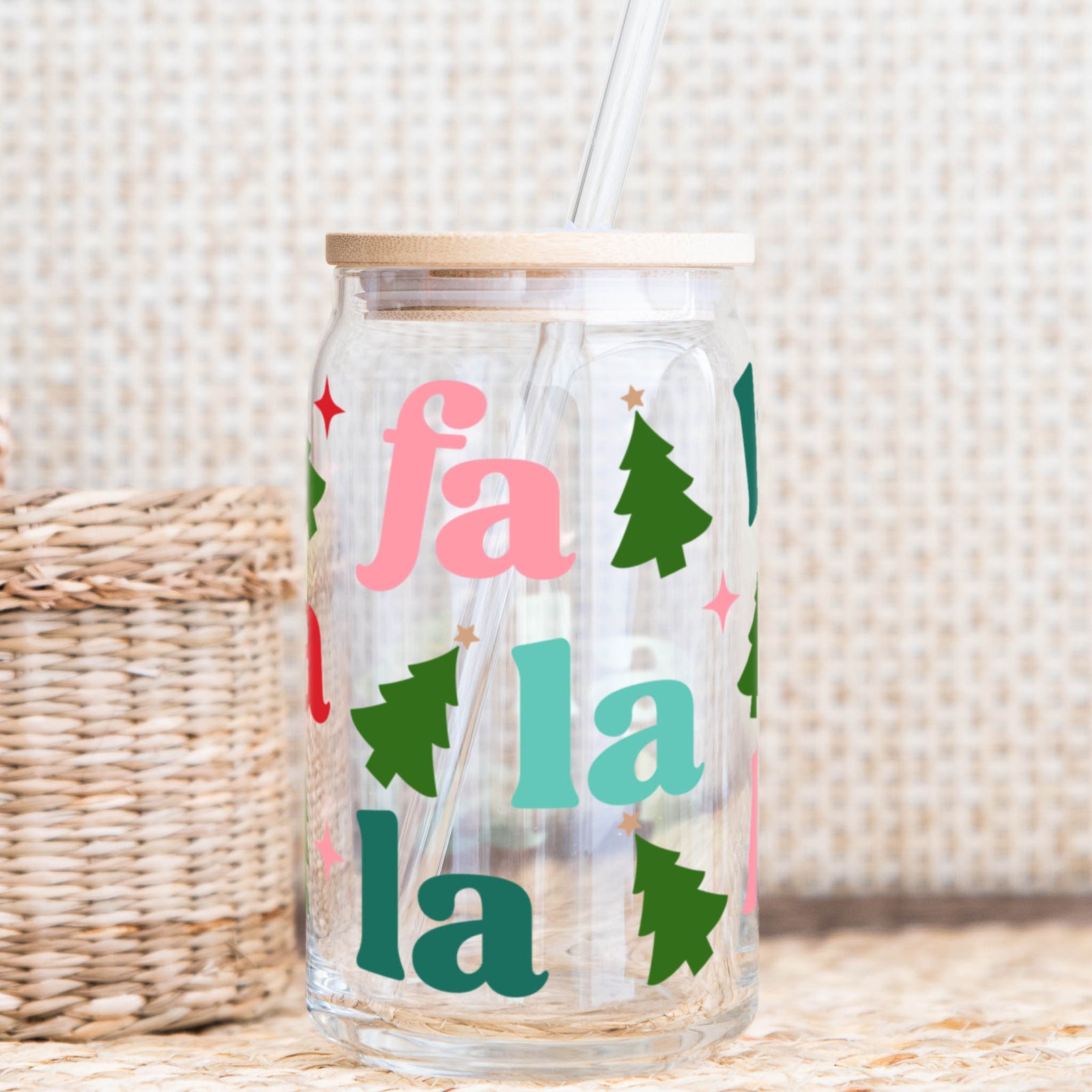 Fa La La glass cup with bamboo lid and straw featuring colorful holiday trees.