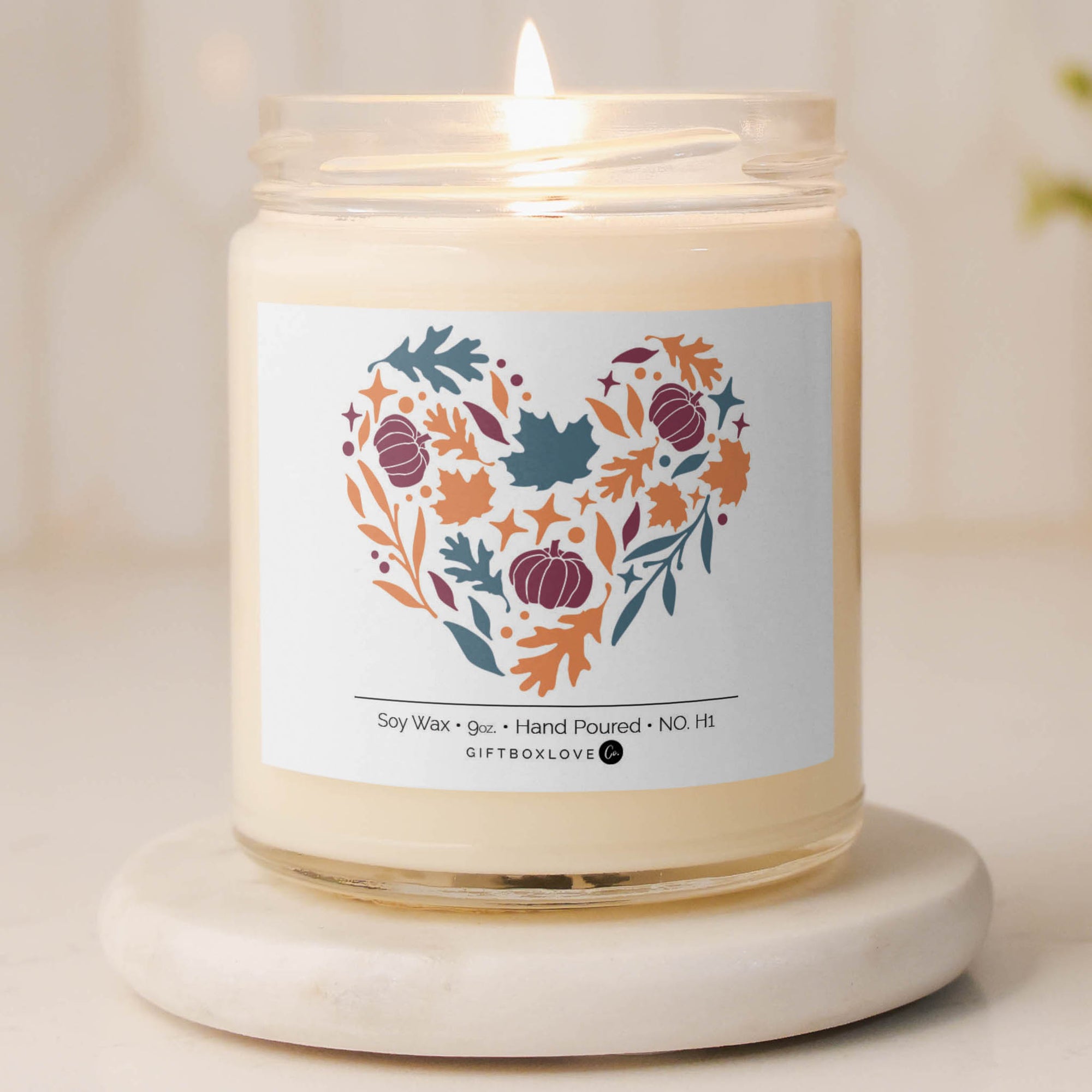 Fall Heart candle with autumn pumpkin and leaf design