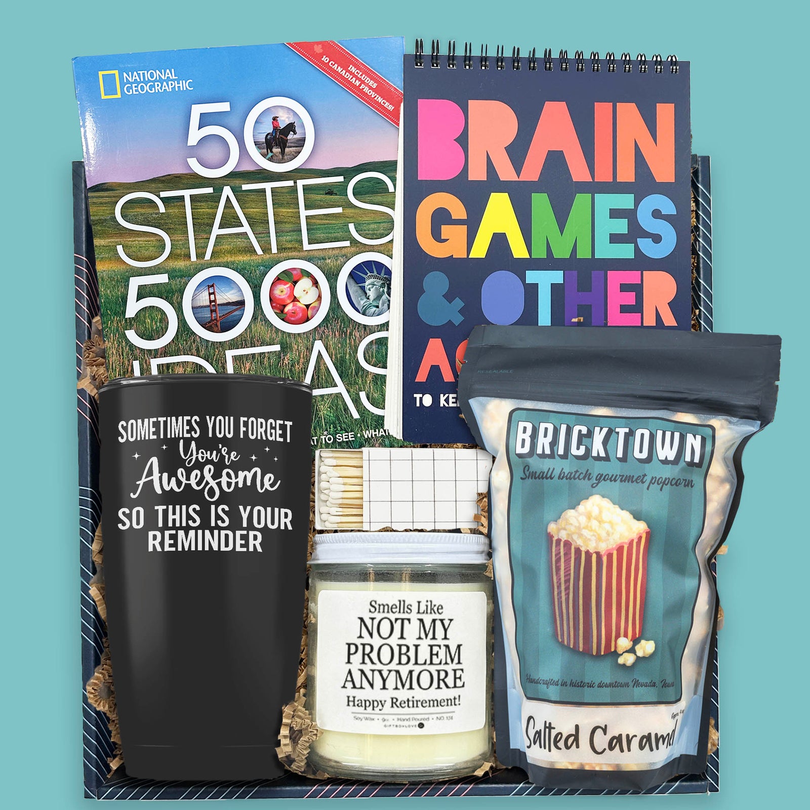 retirement gift box with books popcorn candle and tumbler