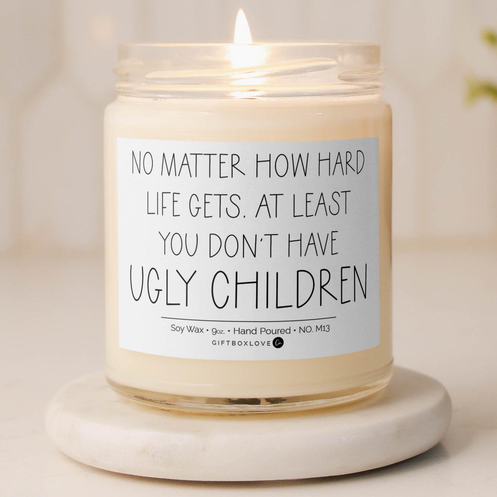 Funny Sea Salt & Orchid candle with label that says “No matter how hard life gets, at least you don’t have ugly children” – 9 oz gift for moms