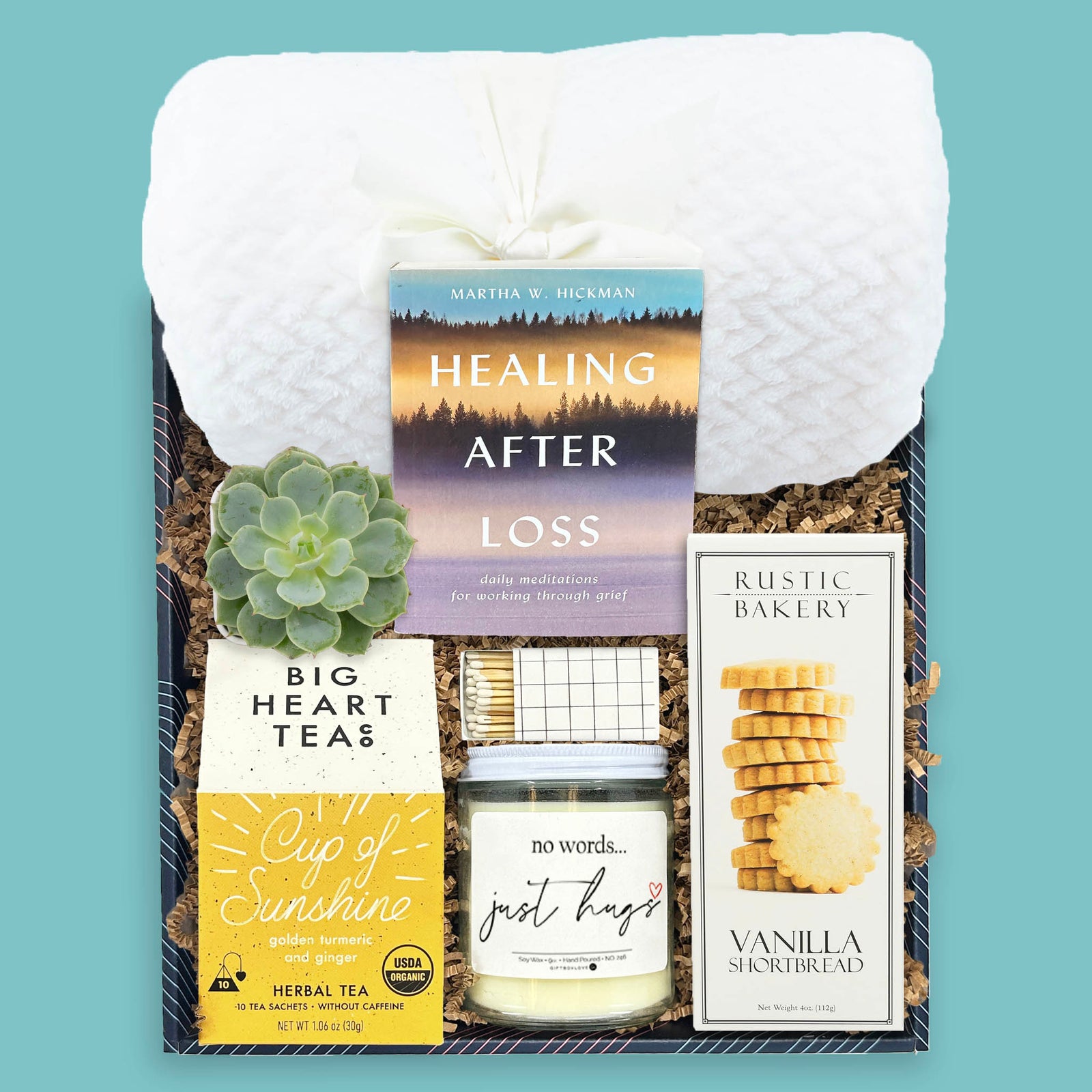 Gentle Embrace sympathy gift box with blanket tea candle cookies and book