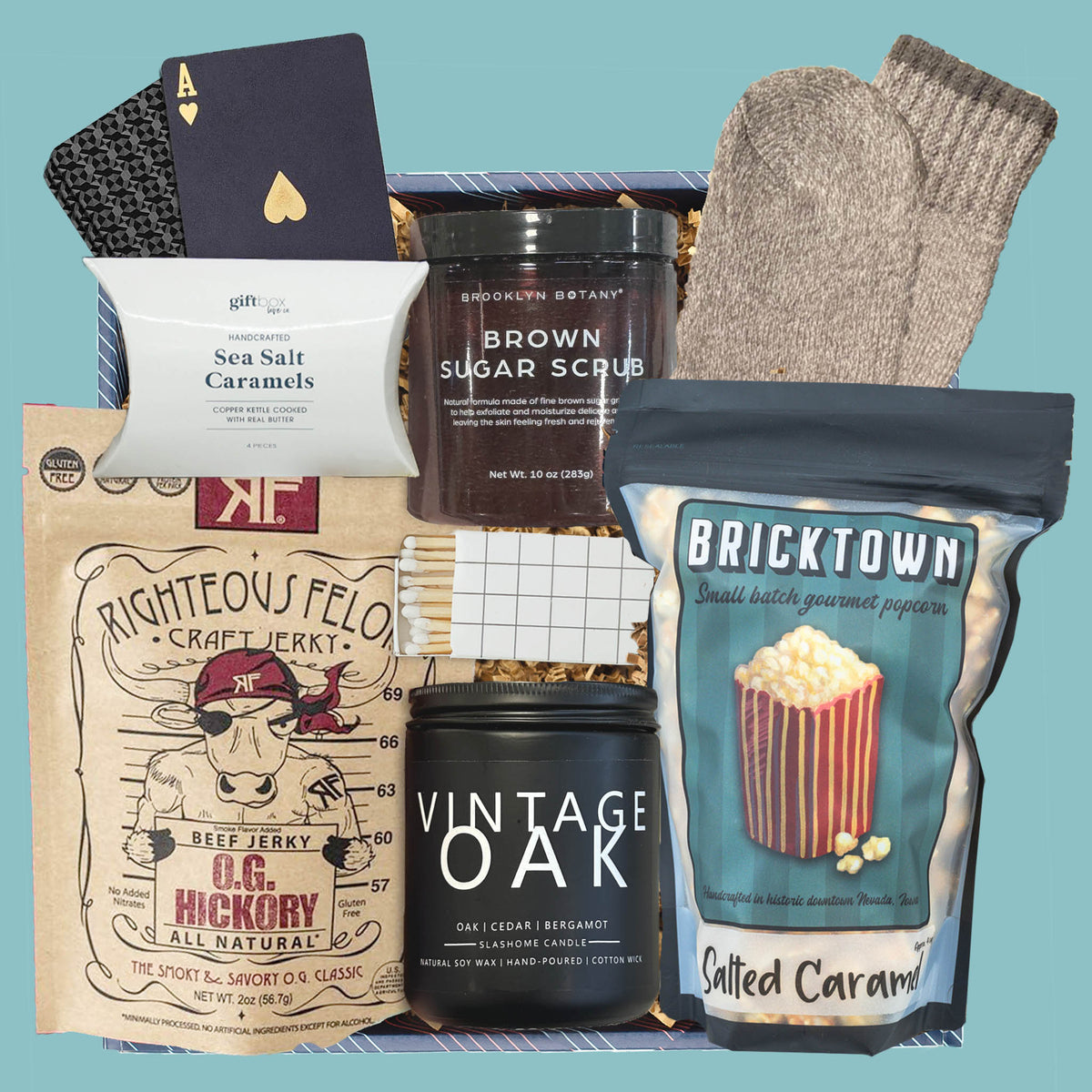 Men’s gift box with candle, gourmet popcorn, beef jerky, socks, and caramels