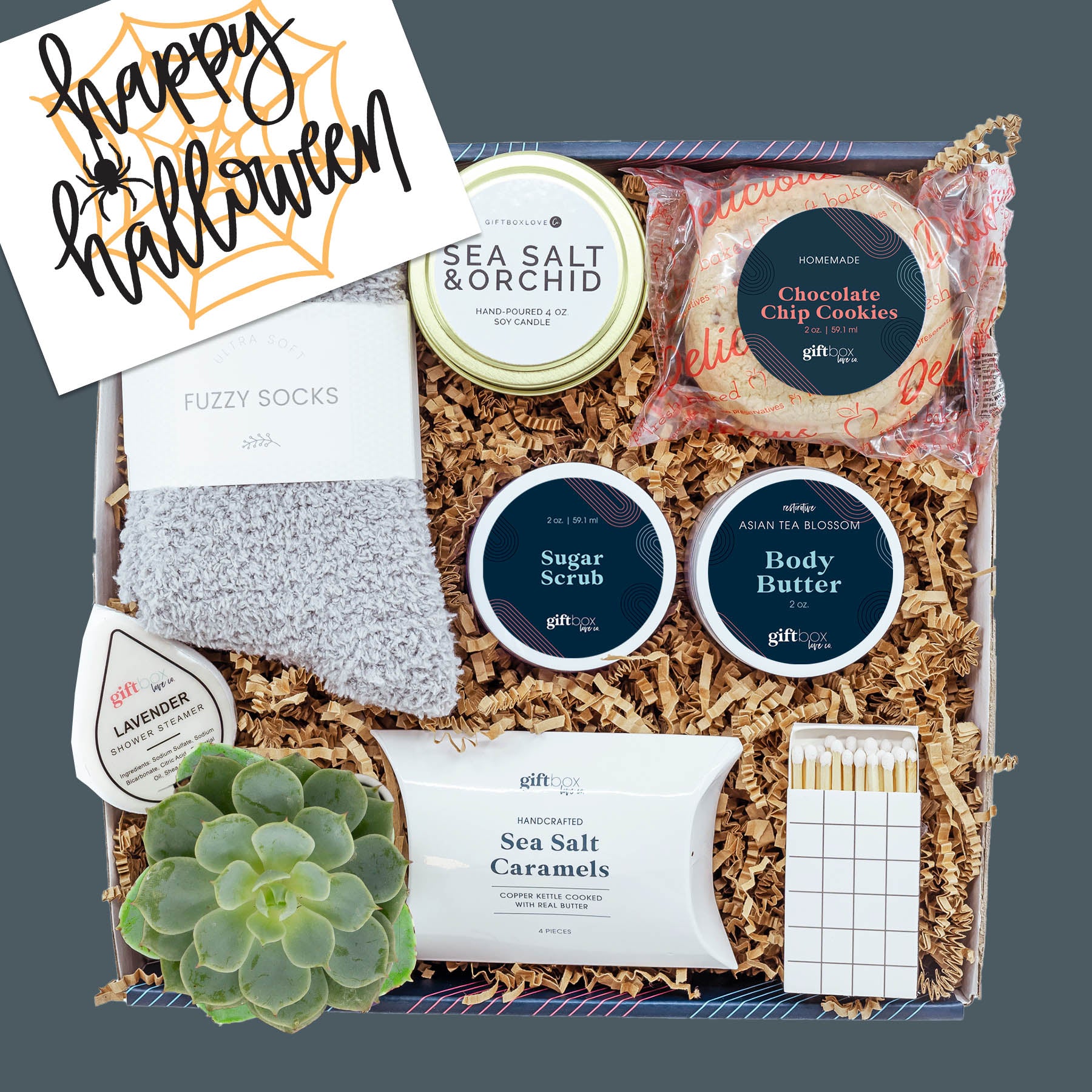 Halloween Soothe & Sweeten Gift Box with candle, socks, caramels, cookie, skincare, succulent, and cozy fall treats