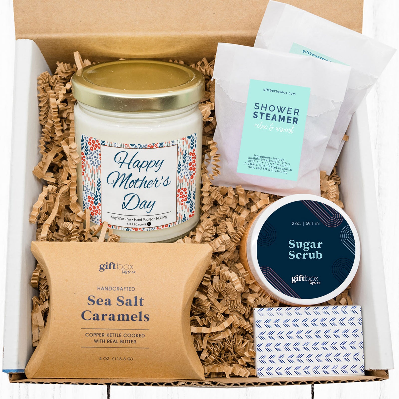 Mother’s Day gift box with Happy Mother’s Day candle, caramels, shower steamers, sugar scrub, and matches