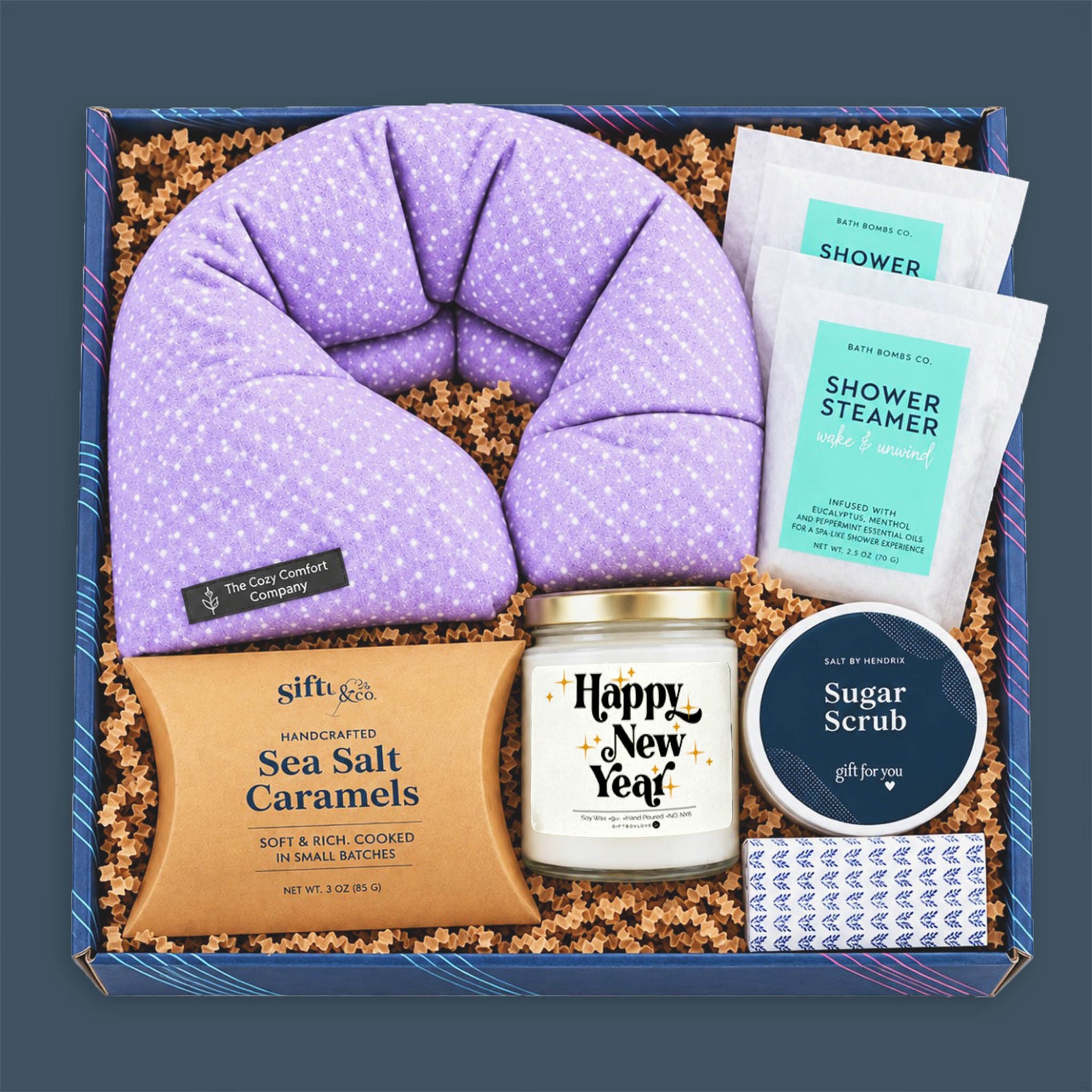 Happy New Year Candle Gift Box with lavender neck wrap, Happy New Year candle, shower steamers, sugar scrub, sea salt caramels, and decorative matches