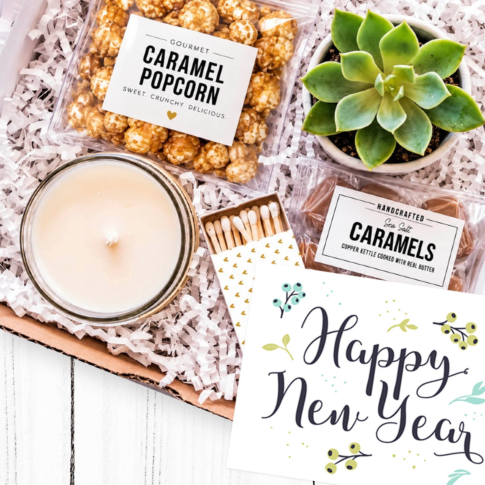 Happy New Year gift box with succulent, candle, caramel popcorn and sea salt caramels