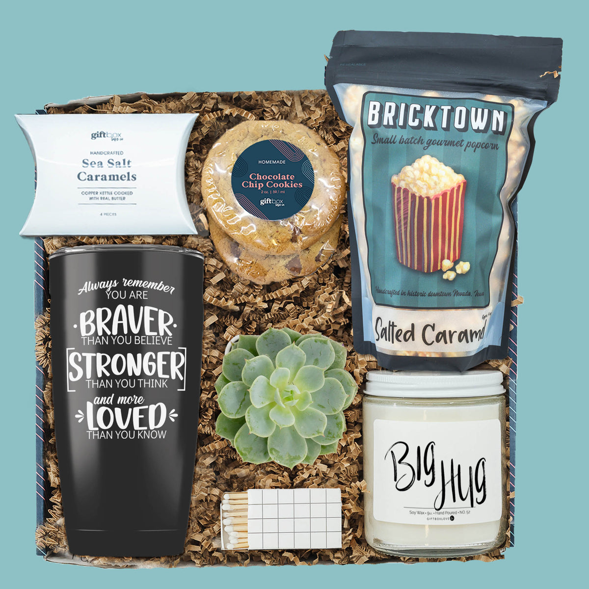 Cancer recovery gift box with candle, tumbler, popcorn, cookies, caramels, and succulent for comfort and encouragement.