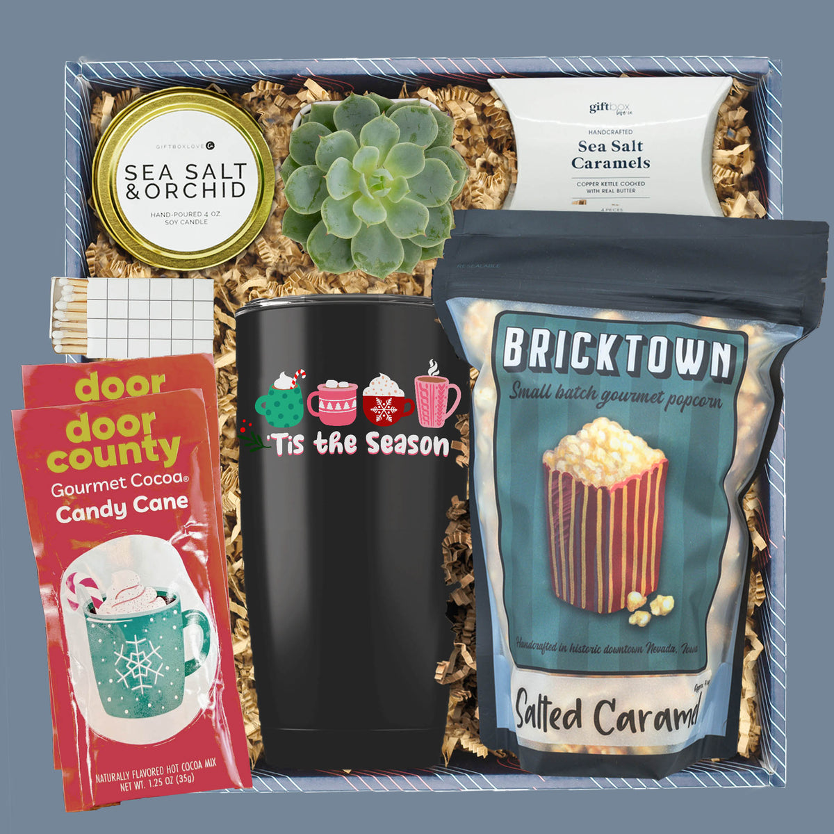 Holiday Warmth and Joy gift box with cocoa, popcorn, candle, and succulent