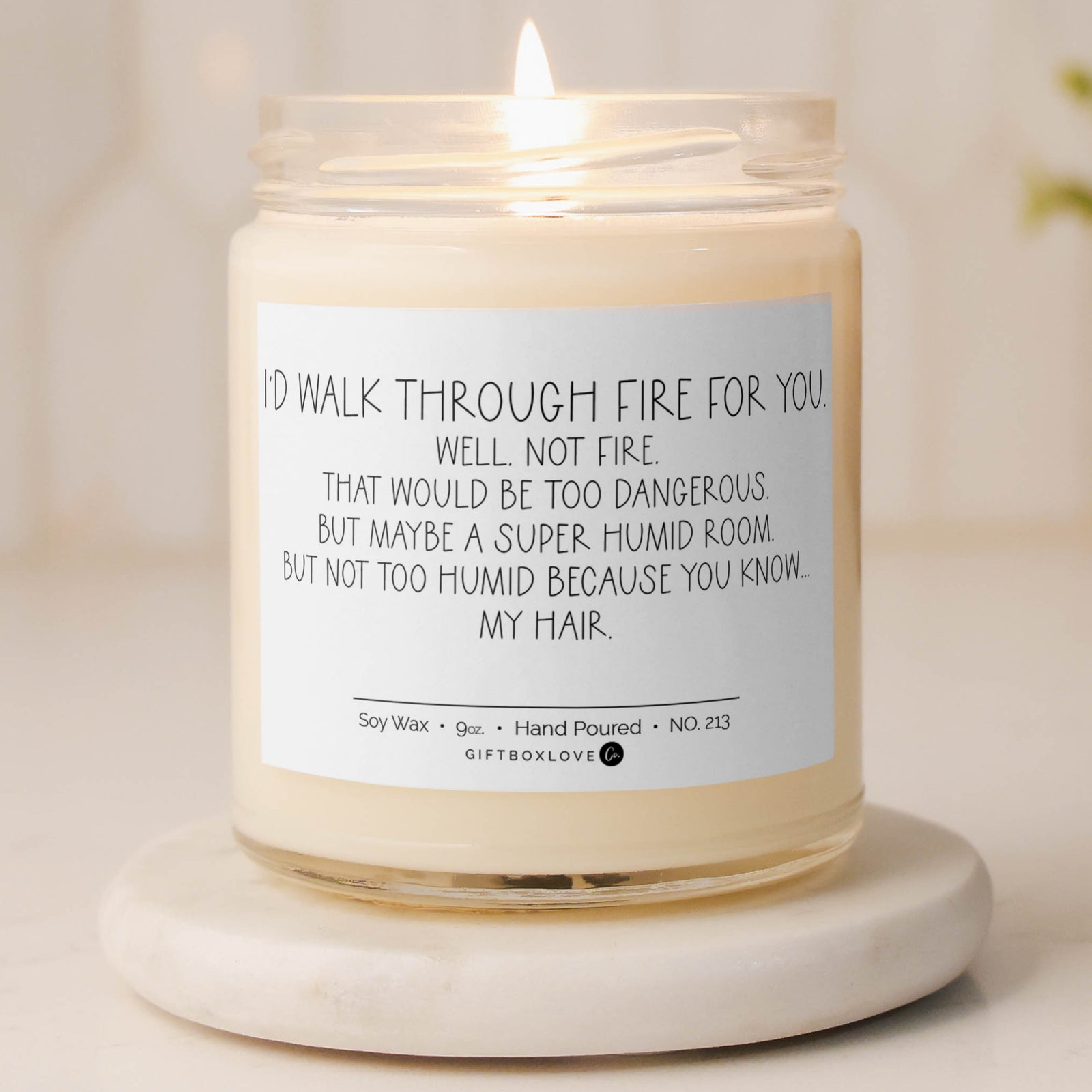 9 oz lavender soy wax candle labeled "I’d Walk Through Fire for You," a humorous and heartfelt gift perfect for loved ones with a sense of humor.