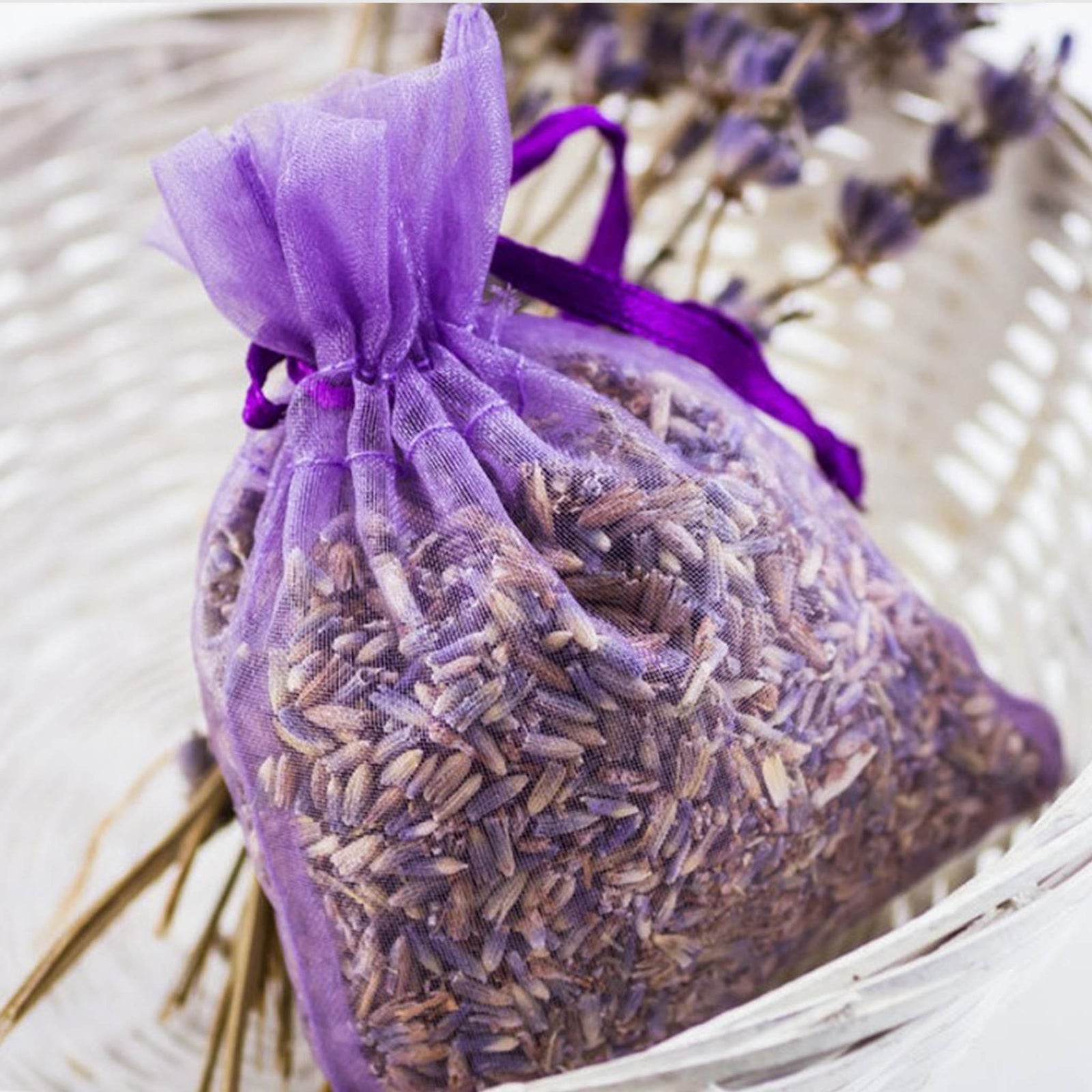Lavender sachet in purple organza bag filled with dried lavender buds, perfect for spa gift boxes and relaxation sets.