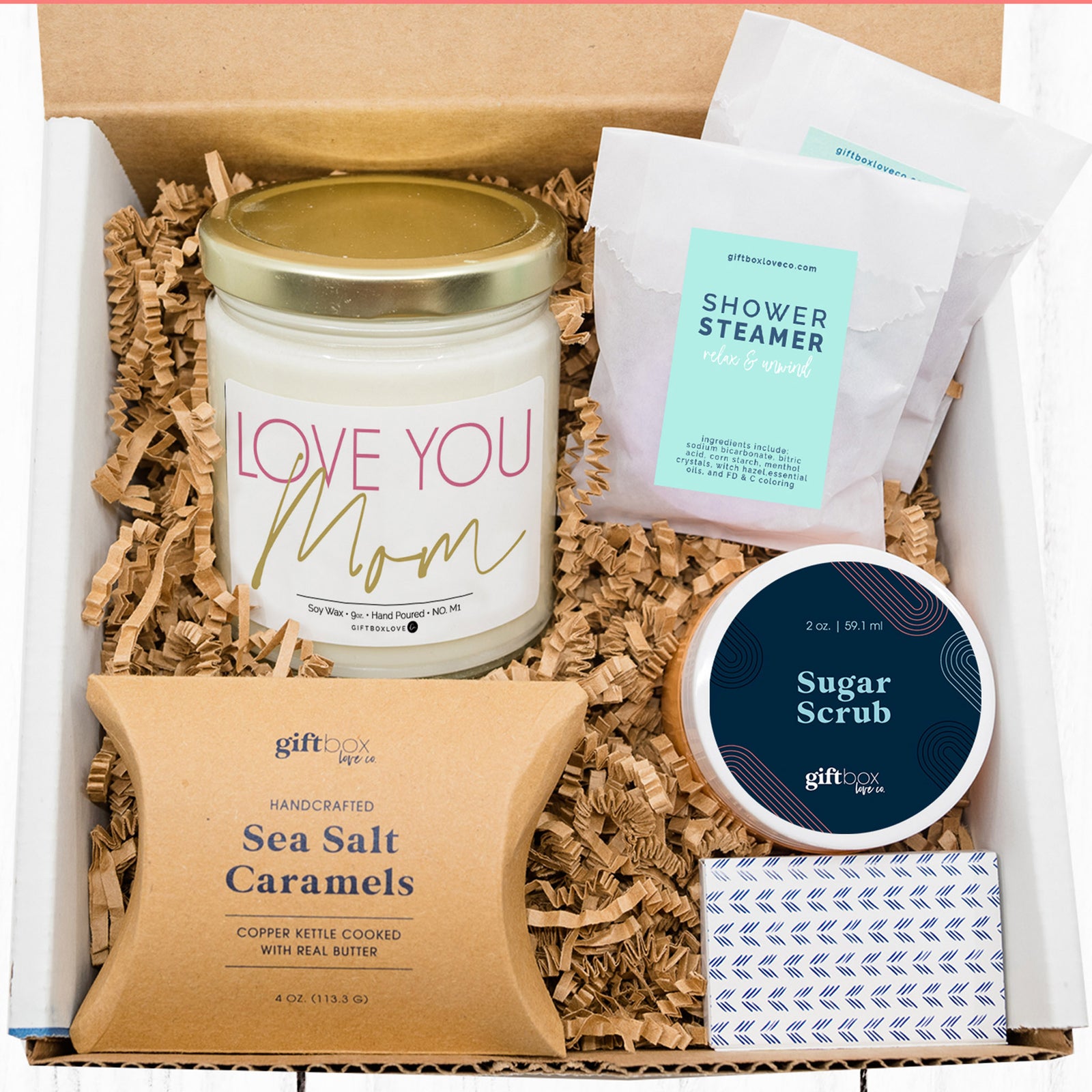 Mother’s Day gift box with “Love You Mom” soy candle, shower steamers, sugar scrub, sea salt caramels, and matches