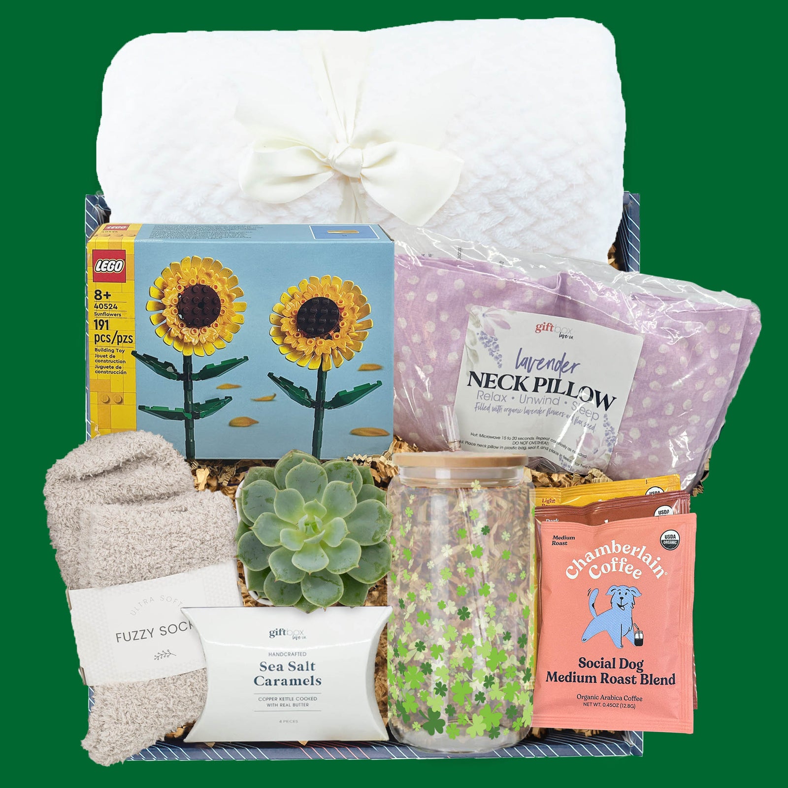 St. Patrick’s Day gift box with blanket, LEGO sunflowers, succulent, shamrock tumbler, coffee packs, fuzzy socks, and caramels.