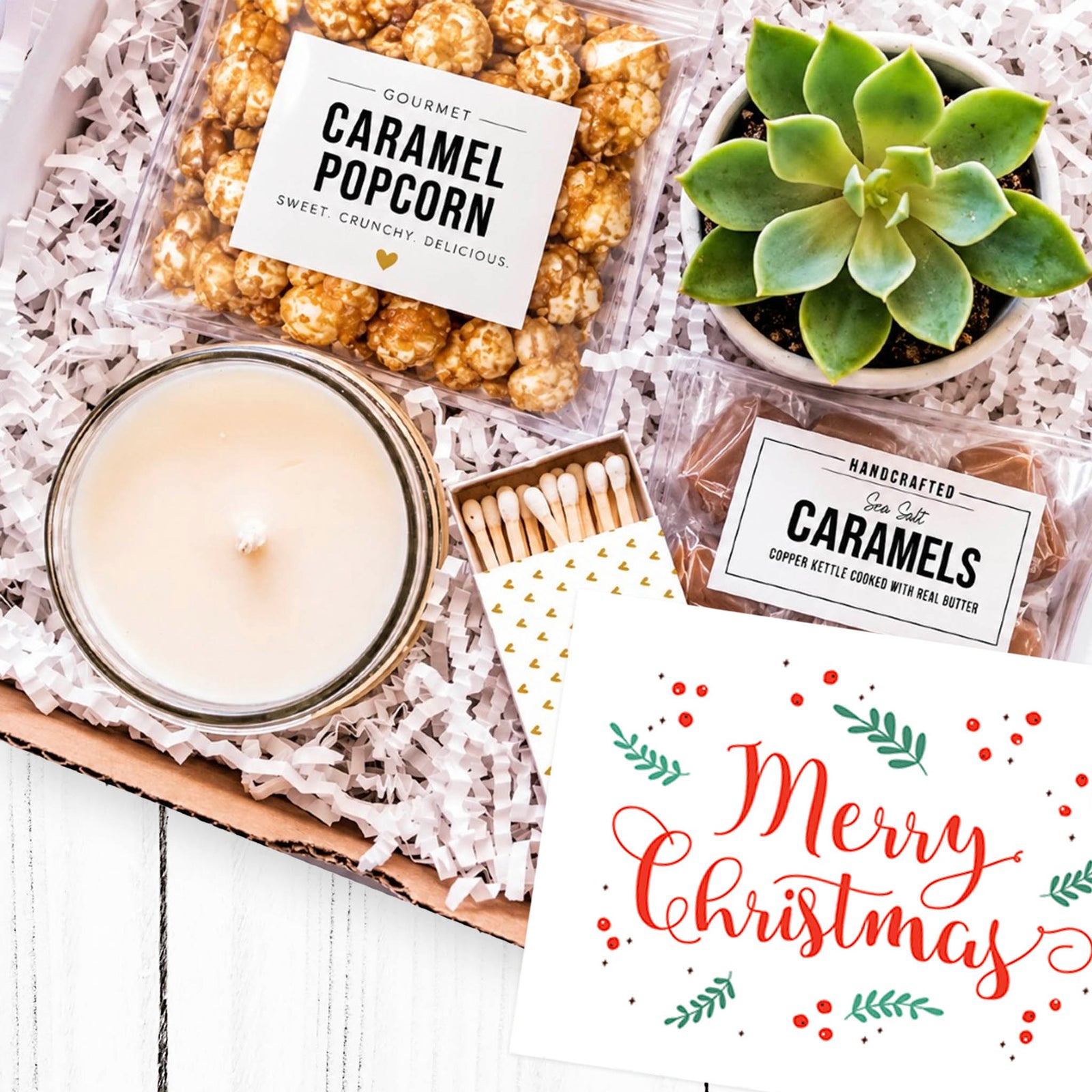 Merry Christmas gift box with succulent, candle, caramel popcorn and sea salt caramels