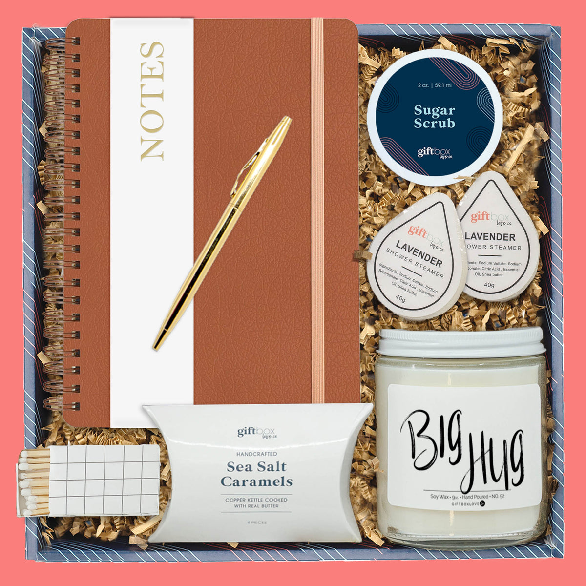 Gift box with journal, gold pen, lavender steamers, candle, sugar scrub, and sea salt caramels.