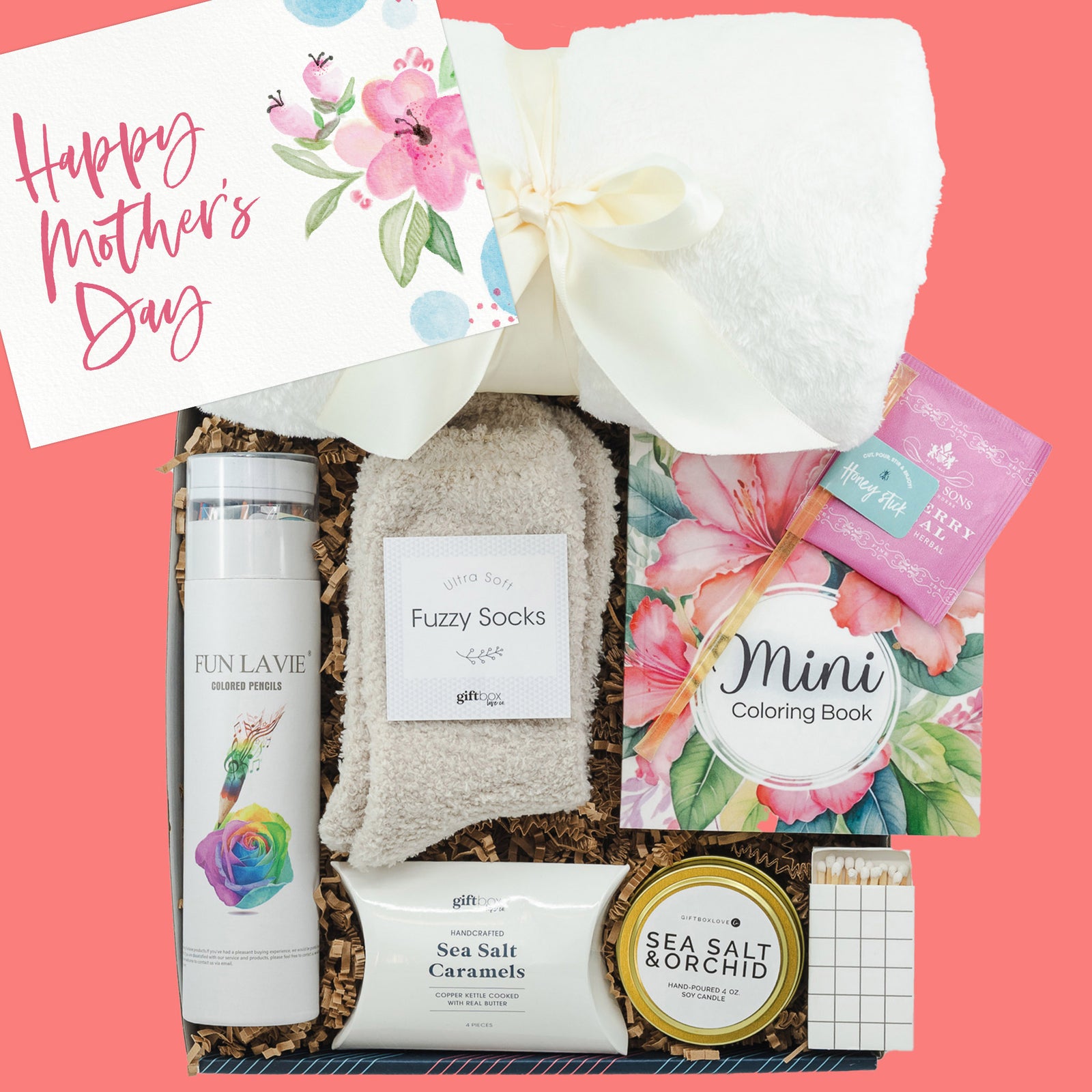 Mother’s Day gift box with blanket, coloring book, tea, socks, candle, and caramels