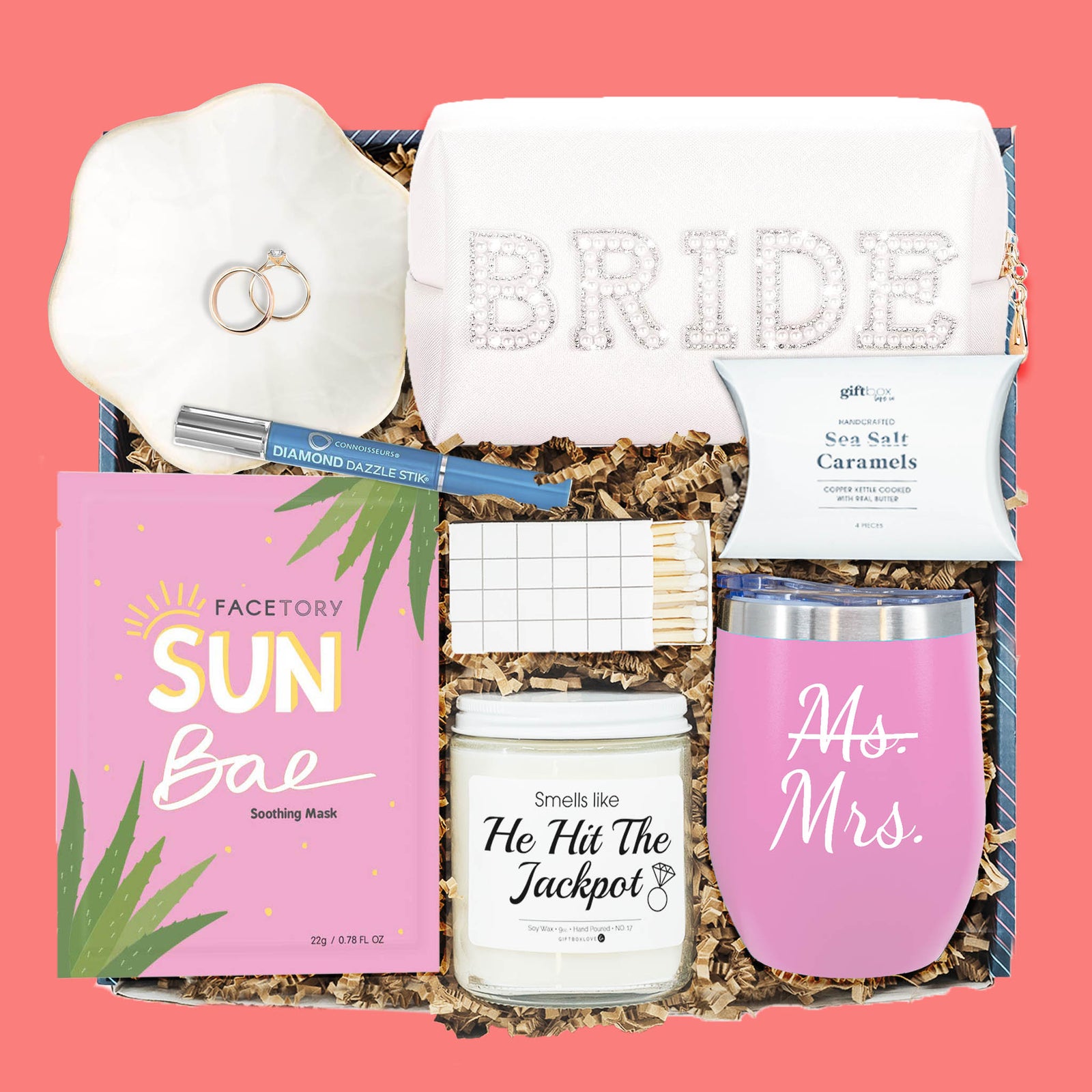 Ms. to Mrs. engagement gift box with tumbler, candle, caramels, makeup bag, ring cleaner, and ring dish.