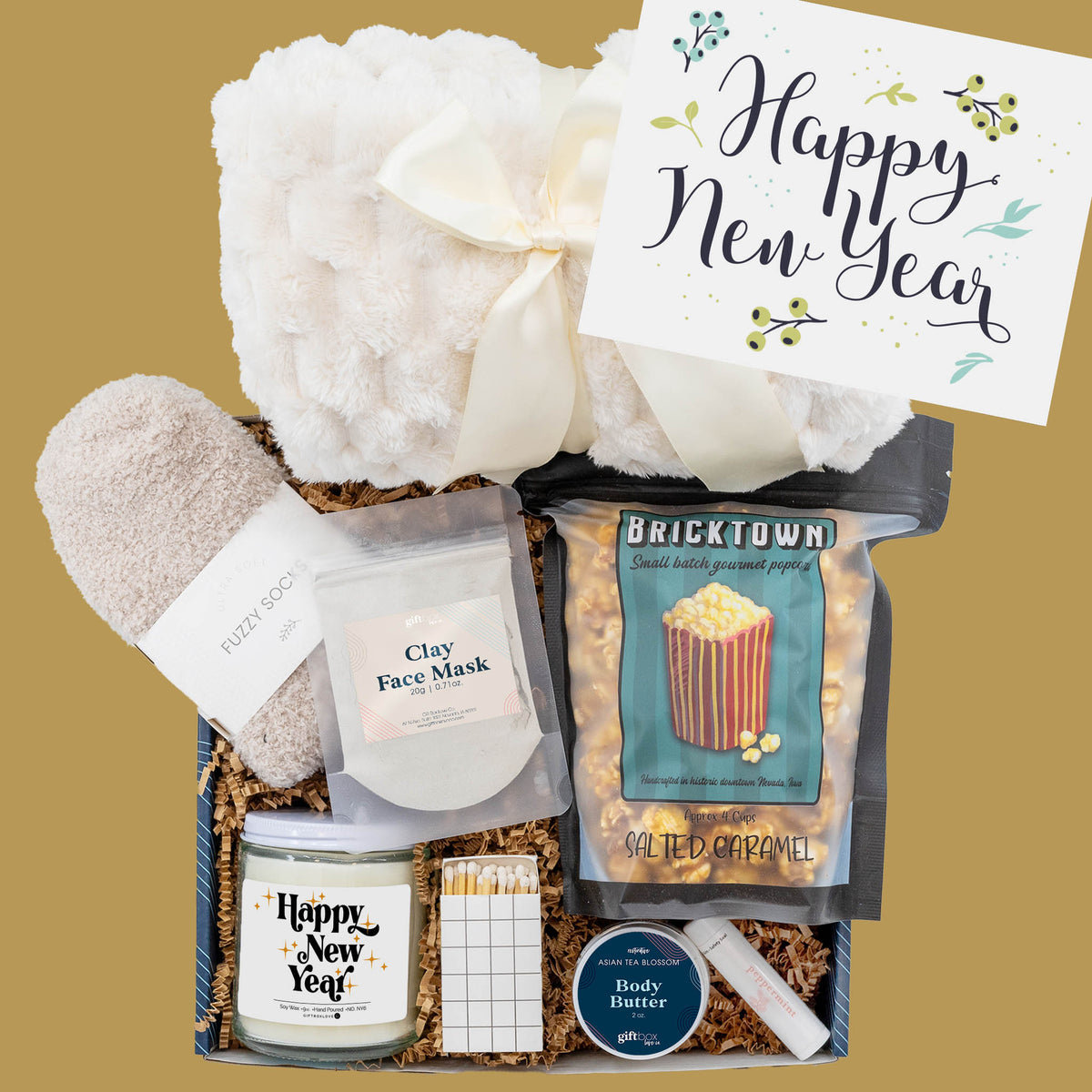 New Year Comfort and Care Box with blanket, candle, popcorn, and spa essentials