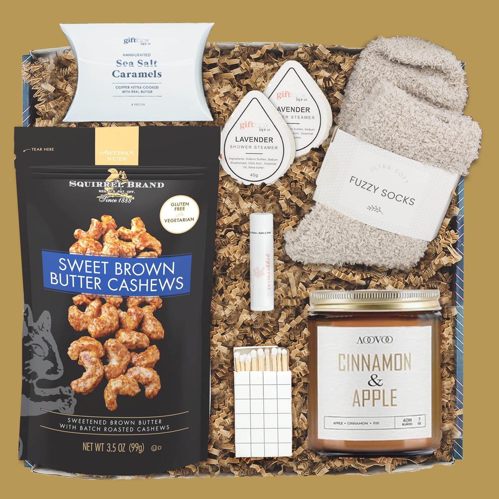 New Year Cozy Indulgence Gift Box with candle, snacks, socks, and caramels