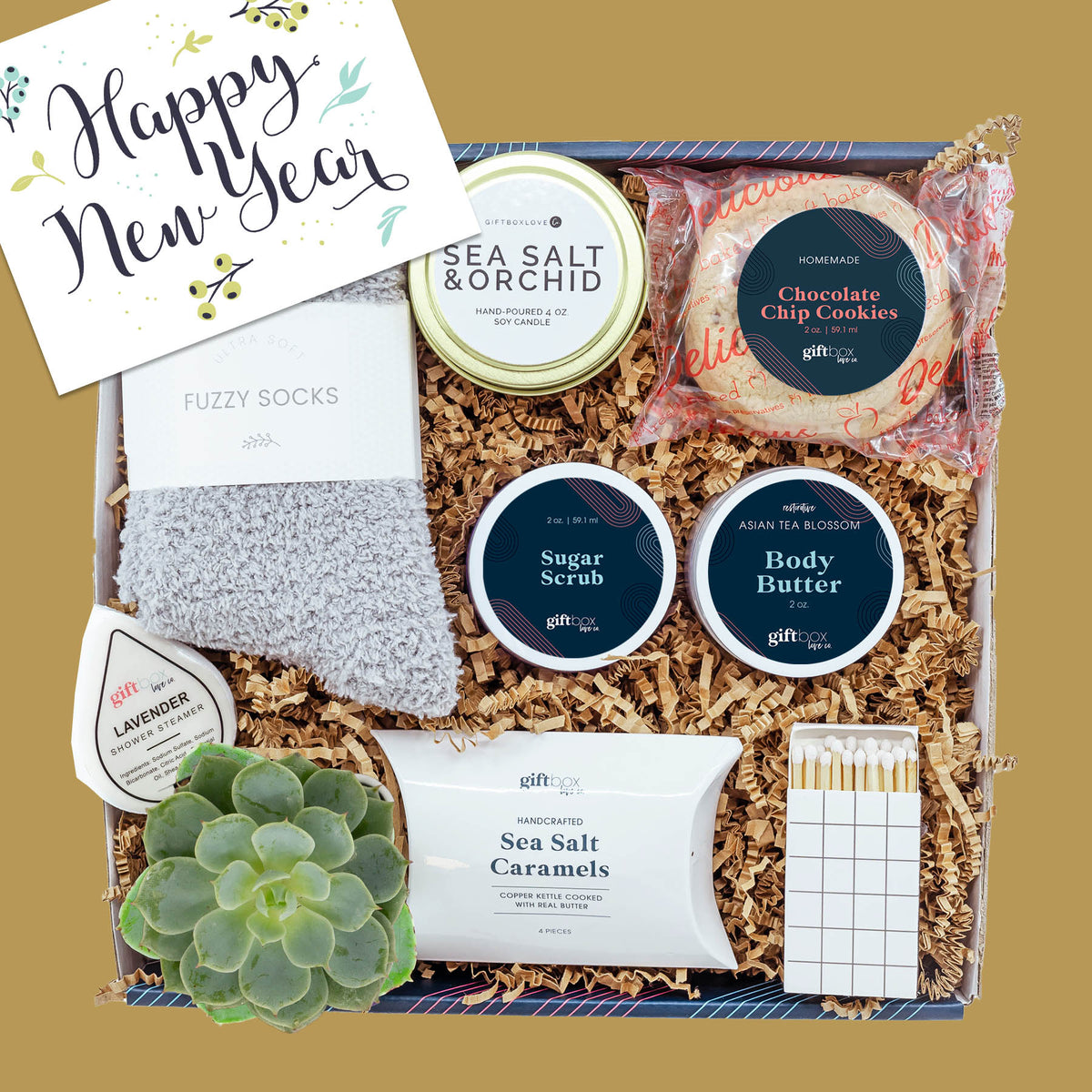 New Year Glow and Gratitude Gift Box with candle, socks, succulent, and sweet treats