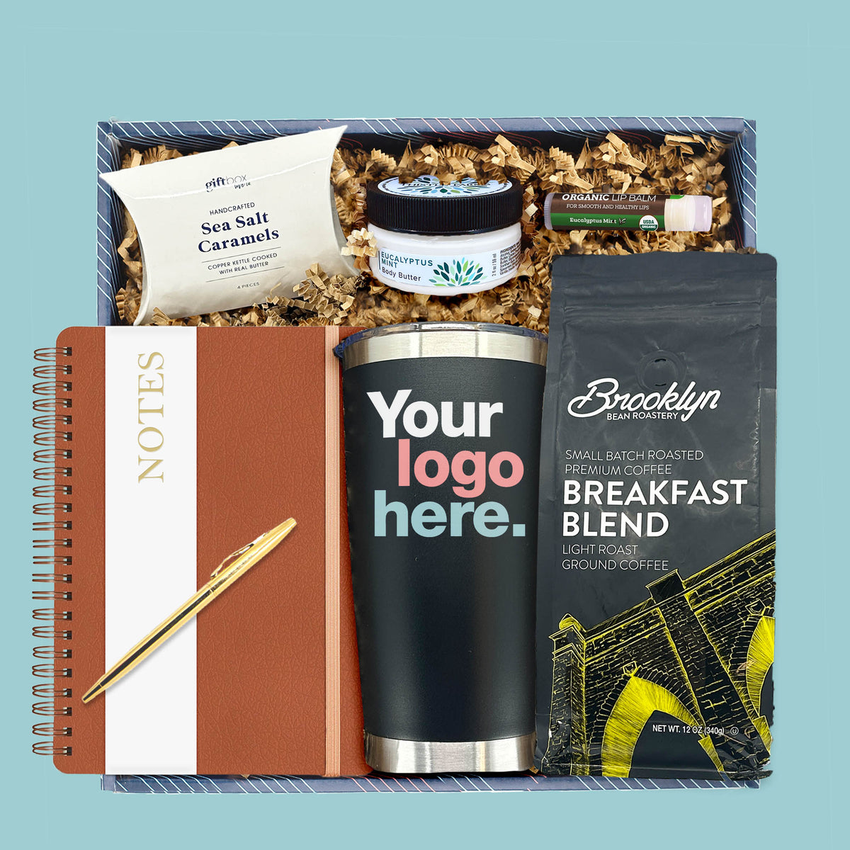 corporate office essentials gift box with coffee tumbler notebook and self care items