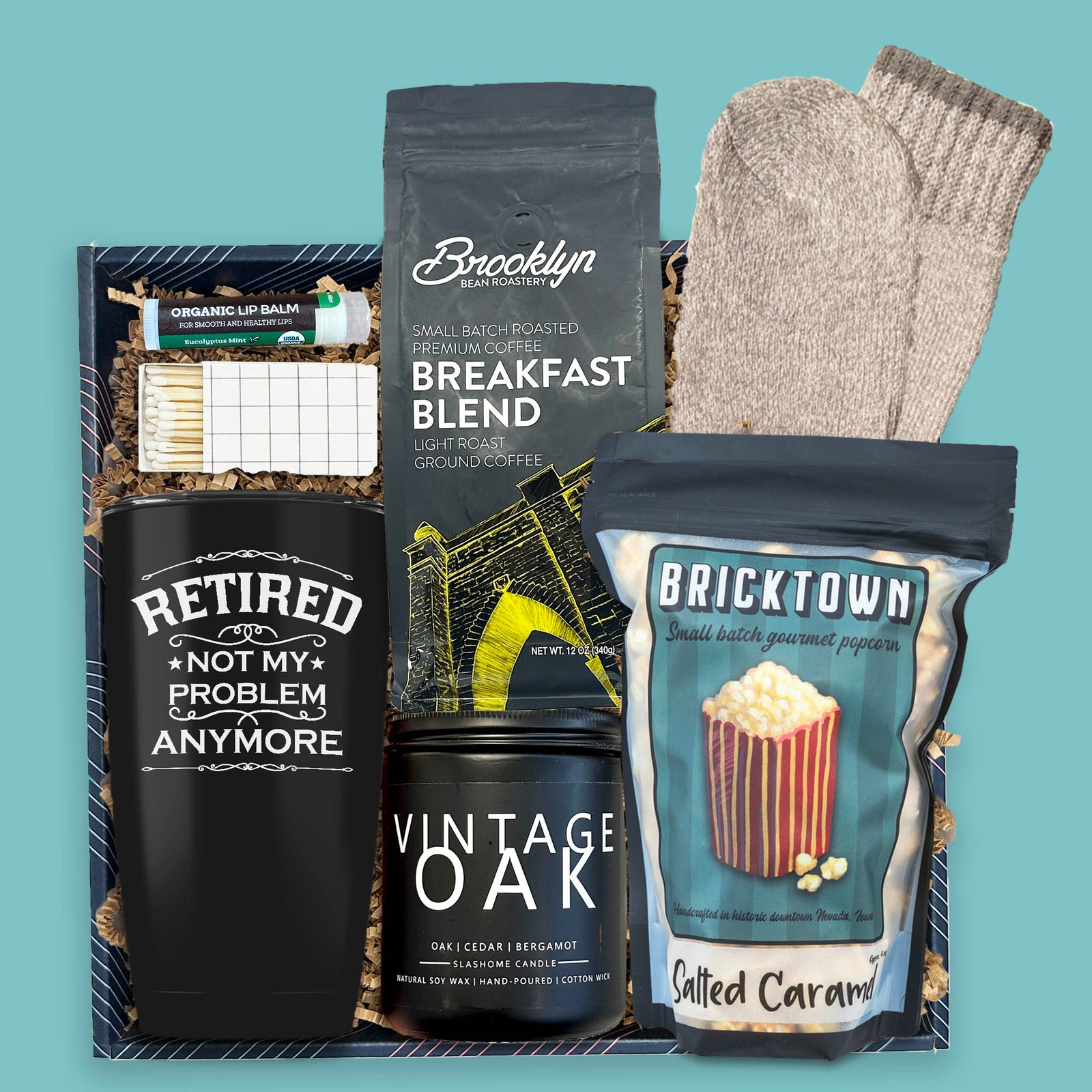 retirement gift box with coffee popcorn candle socks and tumbler