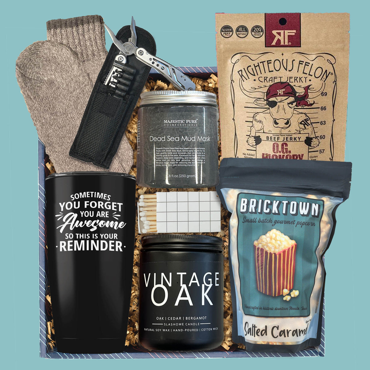 Men’s gift box with tumbler, candle, beef jerky, popcorn, socks, and multi-tool