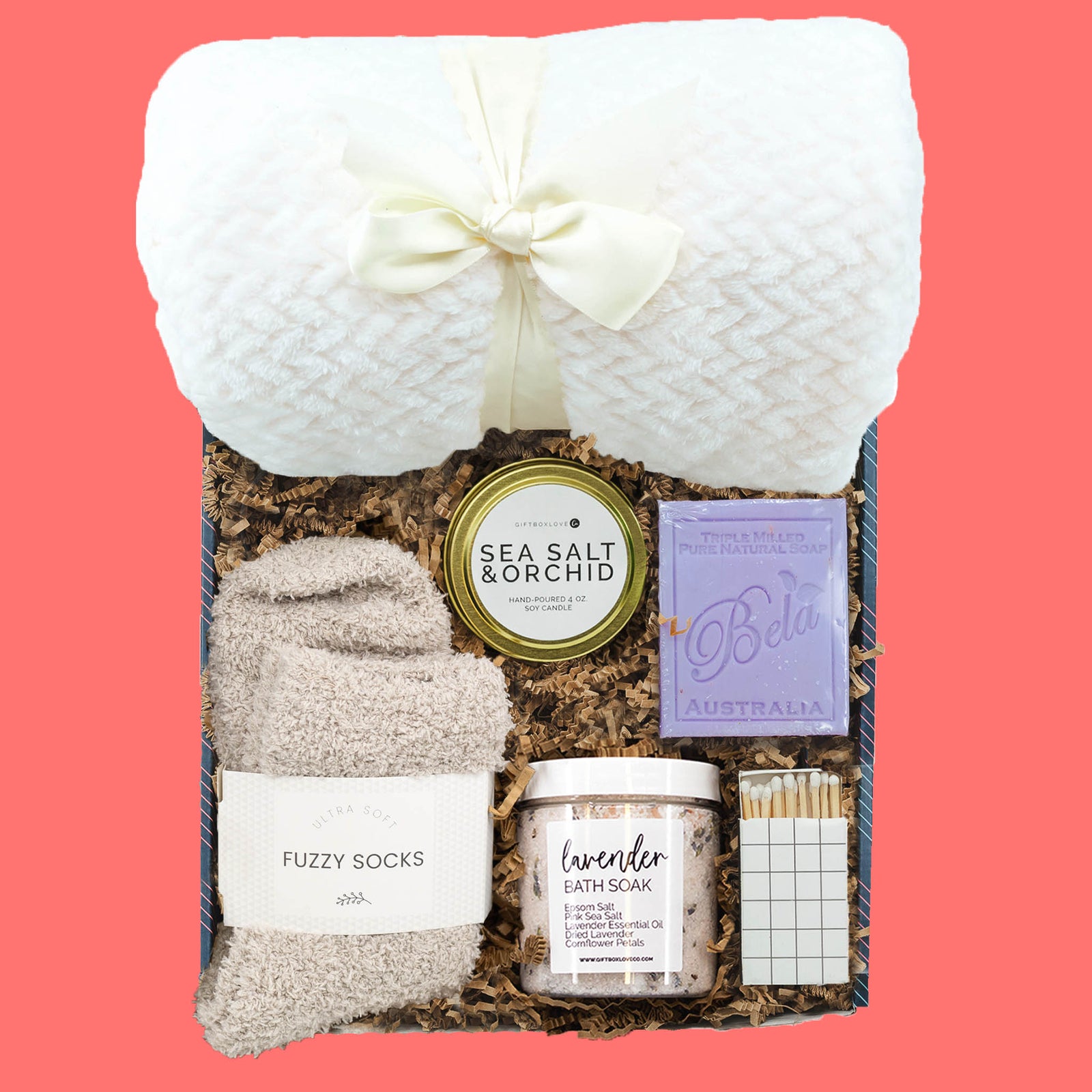 Sympathy gift box with cozy blanket, fuzzy socks, candle, soap, bath soak, and decorative matches