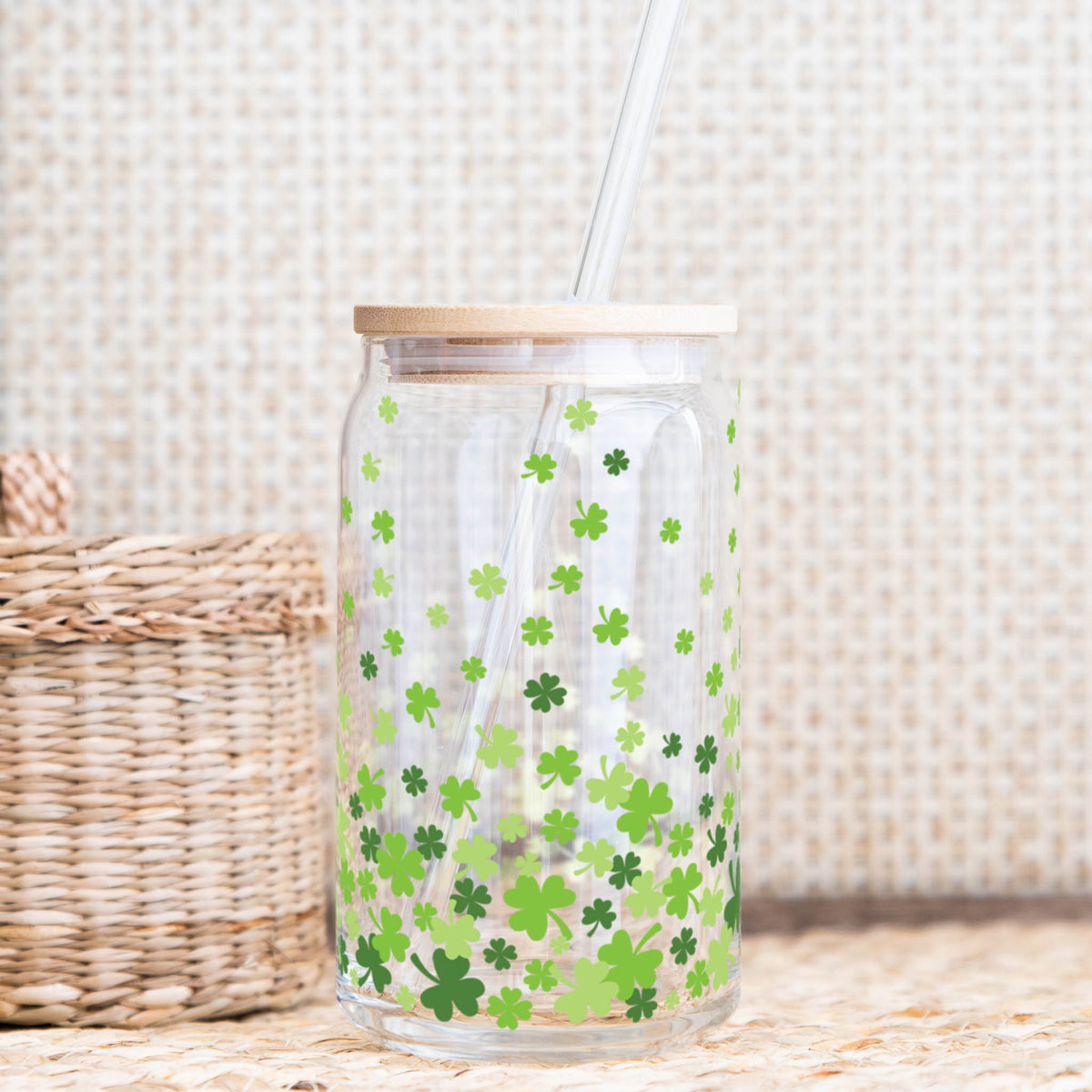 16 oz glass can tumbler with green shamrock design, bamboo lid, and reusable glass straw.