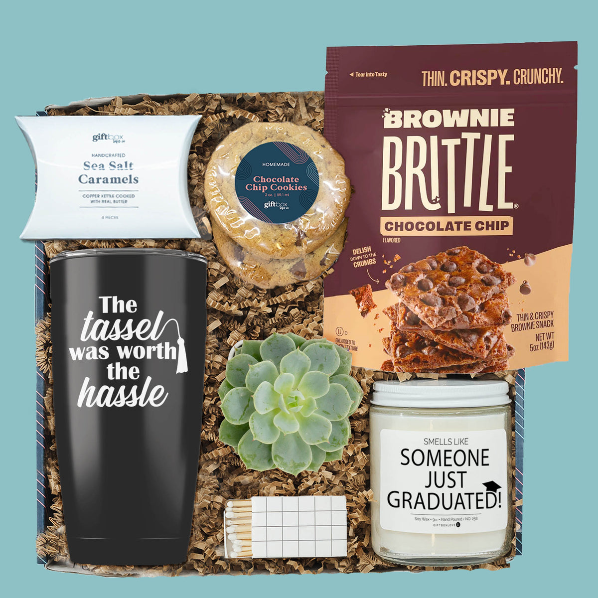 graduation gift box with tumbler candle cookies brownie brittle and succulent