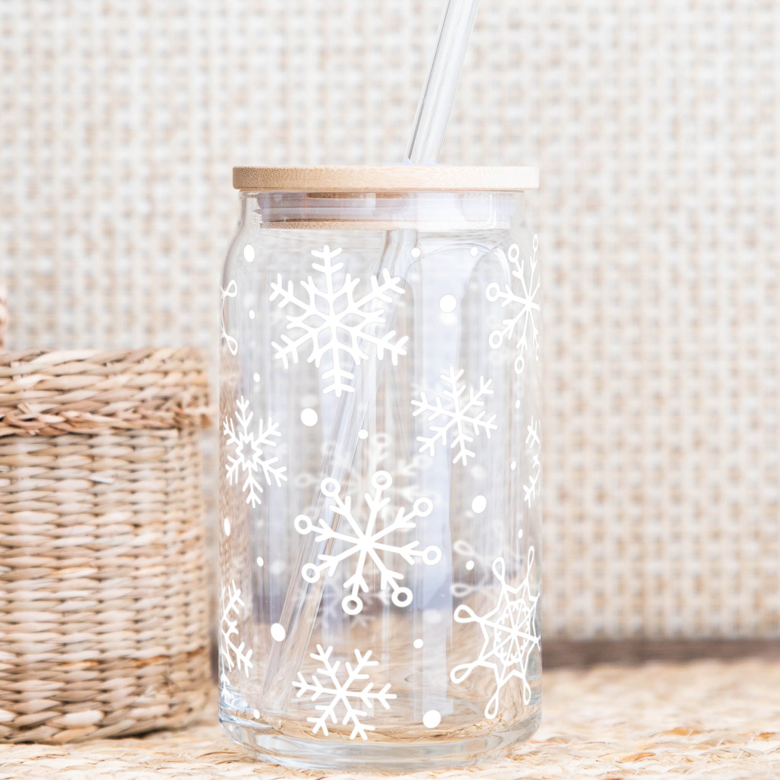 Snowflake glass cup with bamboo lid and glass straw featuring white snowflake design