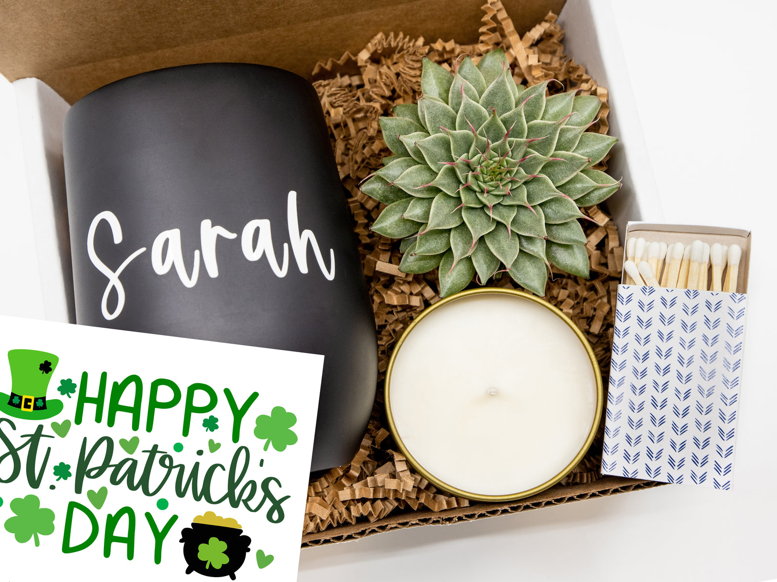 St. Patrick’s Day gift box featuring a personalized tumbler, succulent, 4 oz candle, decorative matches, and a festive card—perfect for spreading luck and joy.