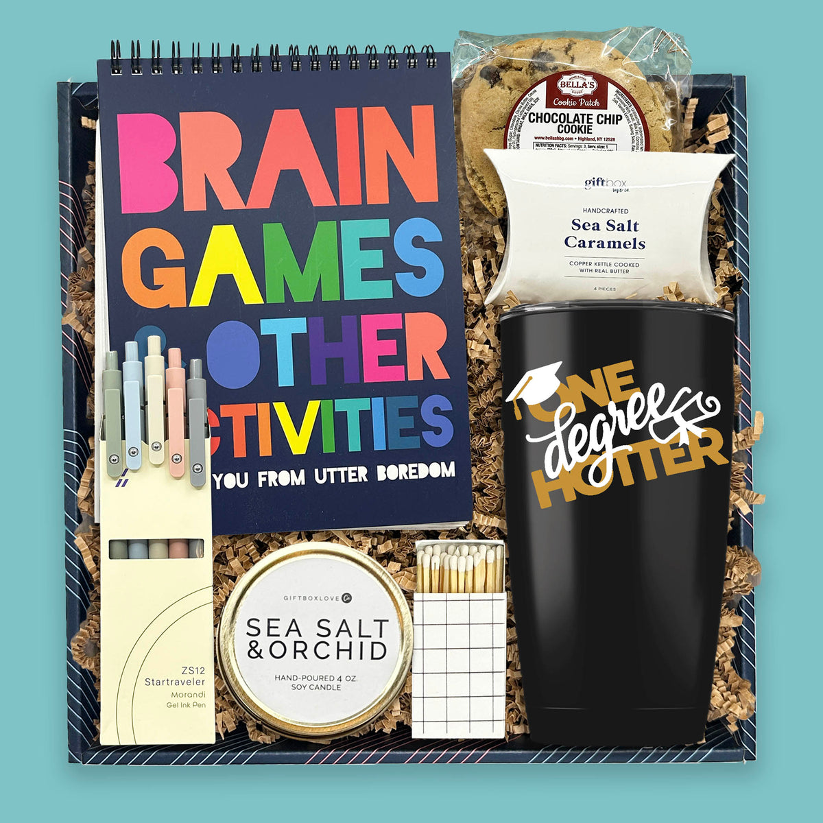 graduation gift box with tumbler candle activity book pens and treats