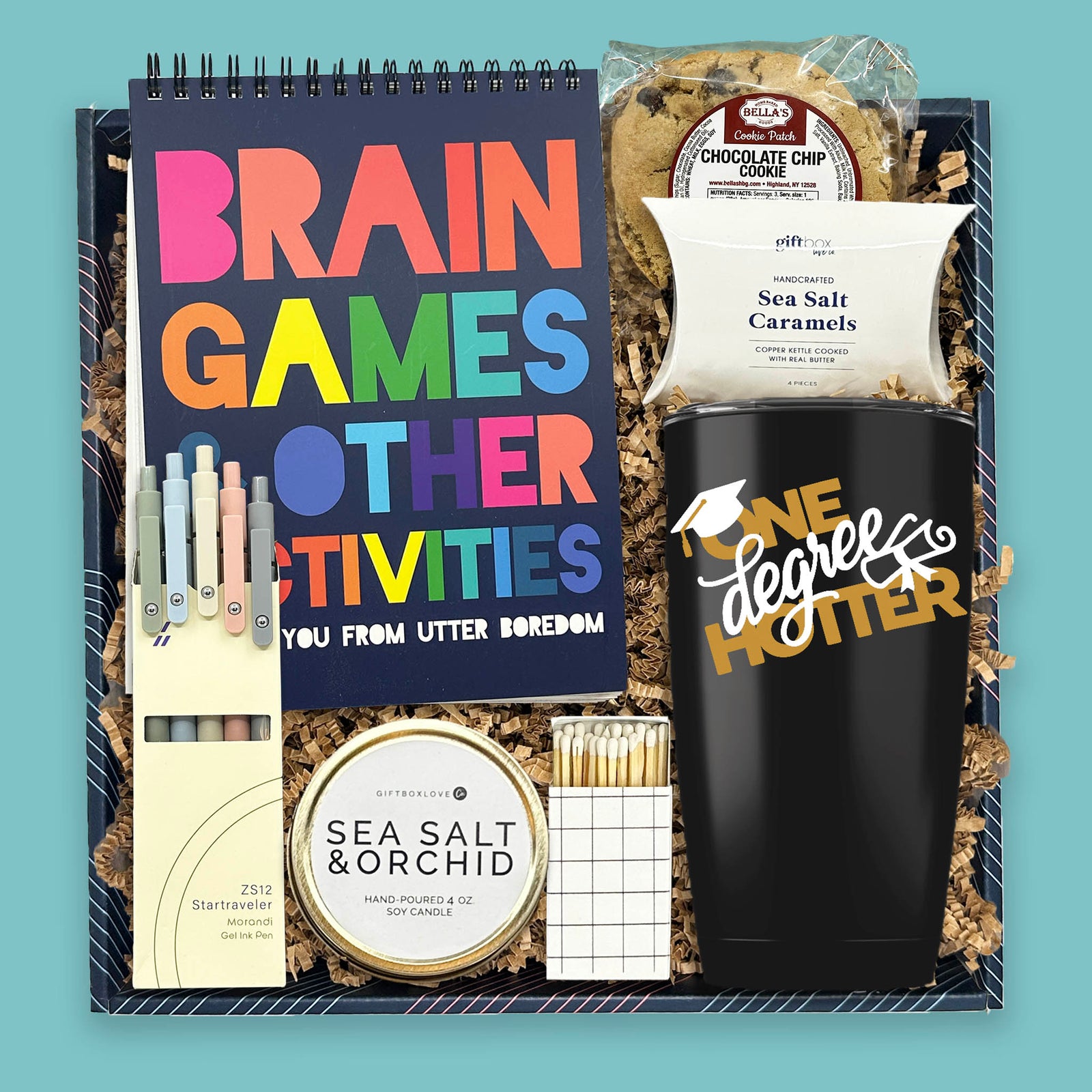 graduation gift box with tumbler candle activity book pens and treats
