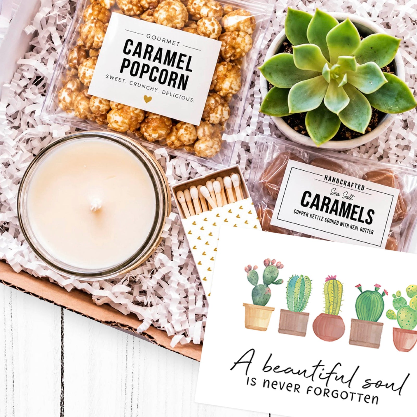Sympathy gift box with succulent, candle, popcorn and caramels