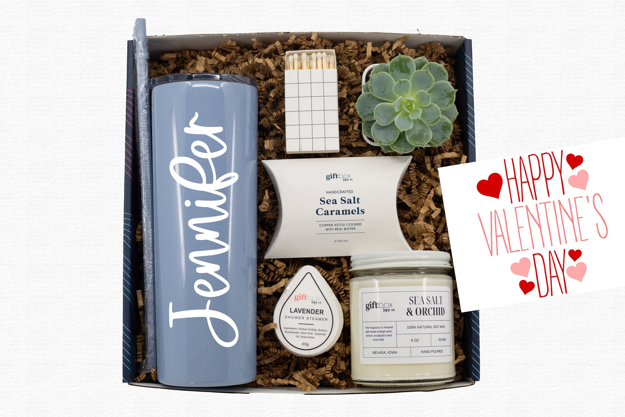 Valentine’s Personalized Tumbler and Succulent Gift Box featuring a succulent, soy candle, personalized tumbler, shower steamer, caramels, and matches.