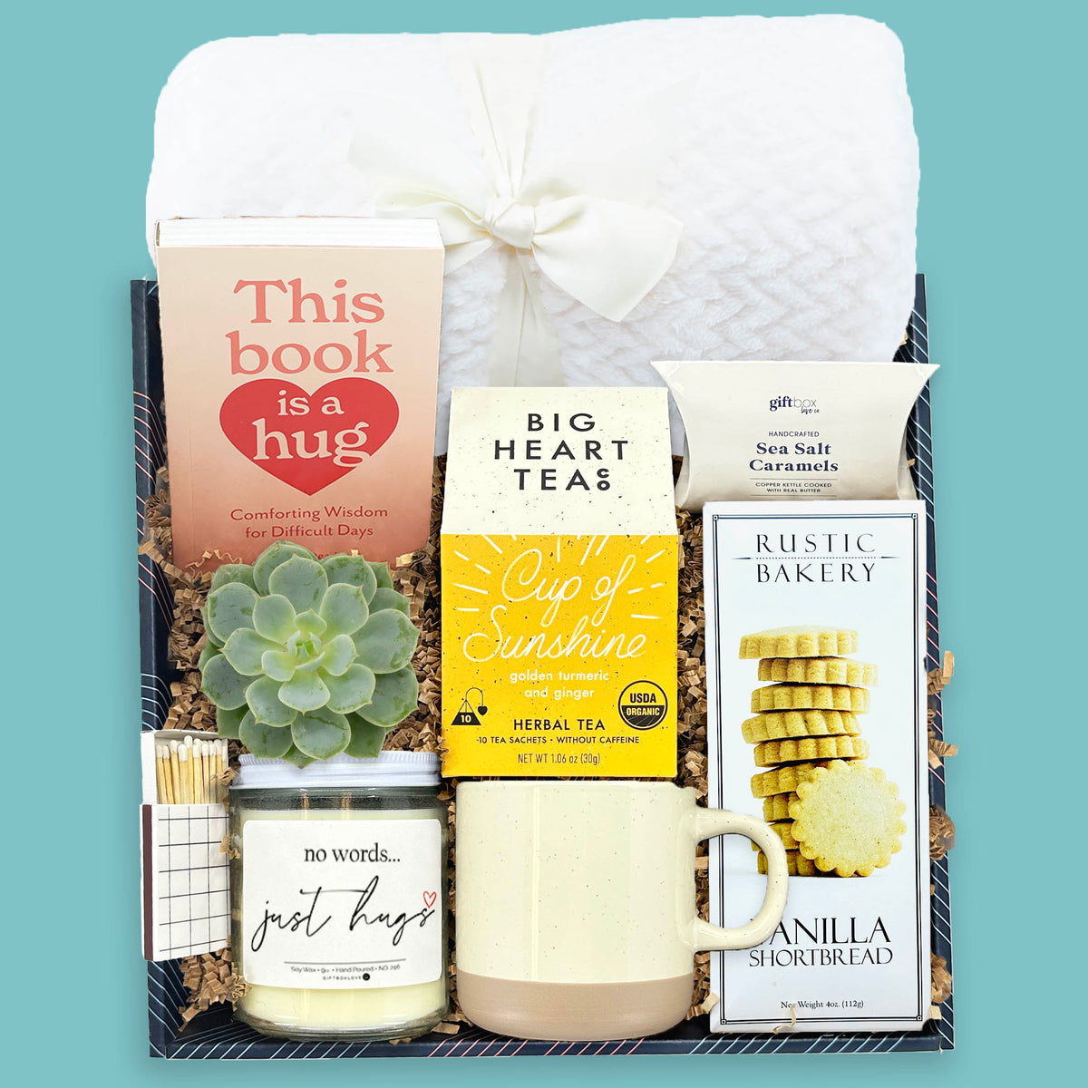 warm hug sympathy gift box with blanket tea candle book and succulent